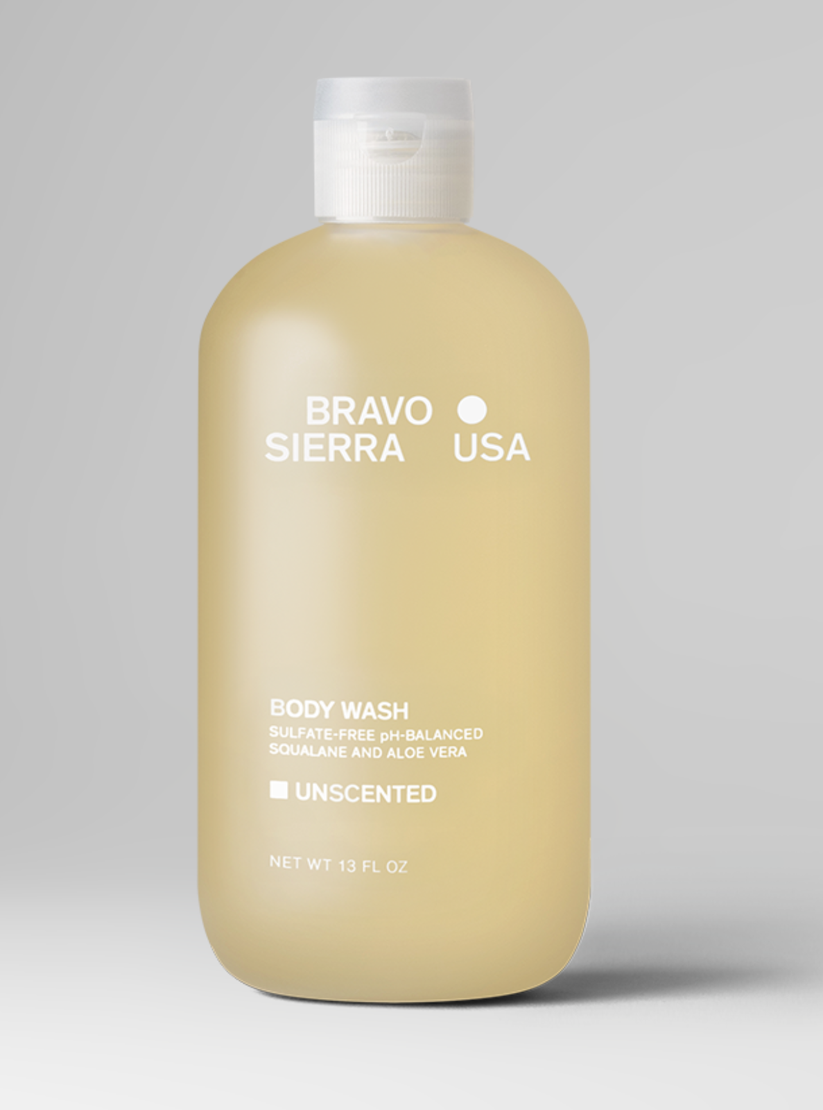 Beige body wash bottle with 'Bravo Sierra USA' branding on a gray background