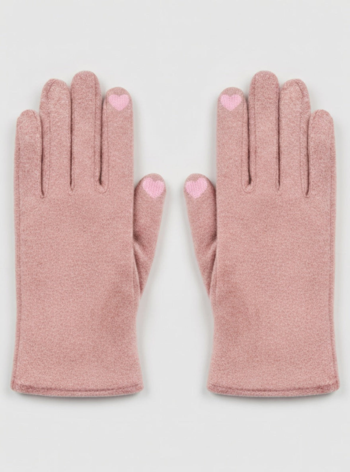 Pair of pink gloves with heart-shaped dots on a light gray background