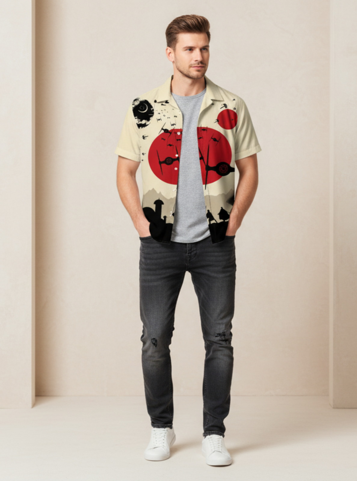 Man wearing a colorful shirt with floral patterns and dark jeans against a plain background