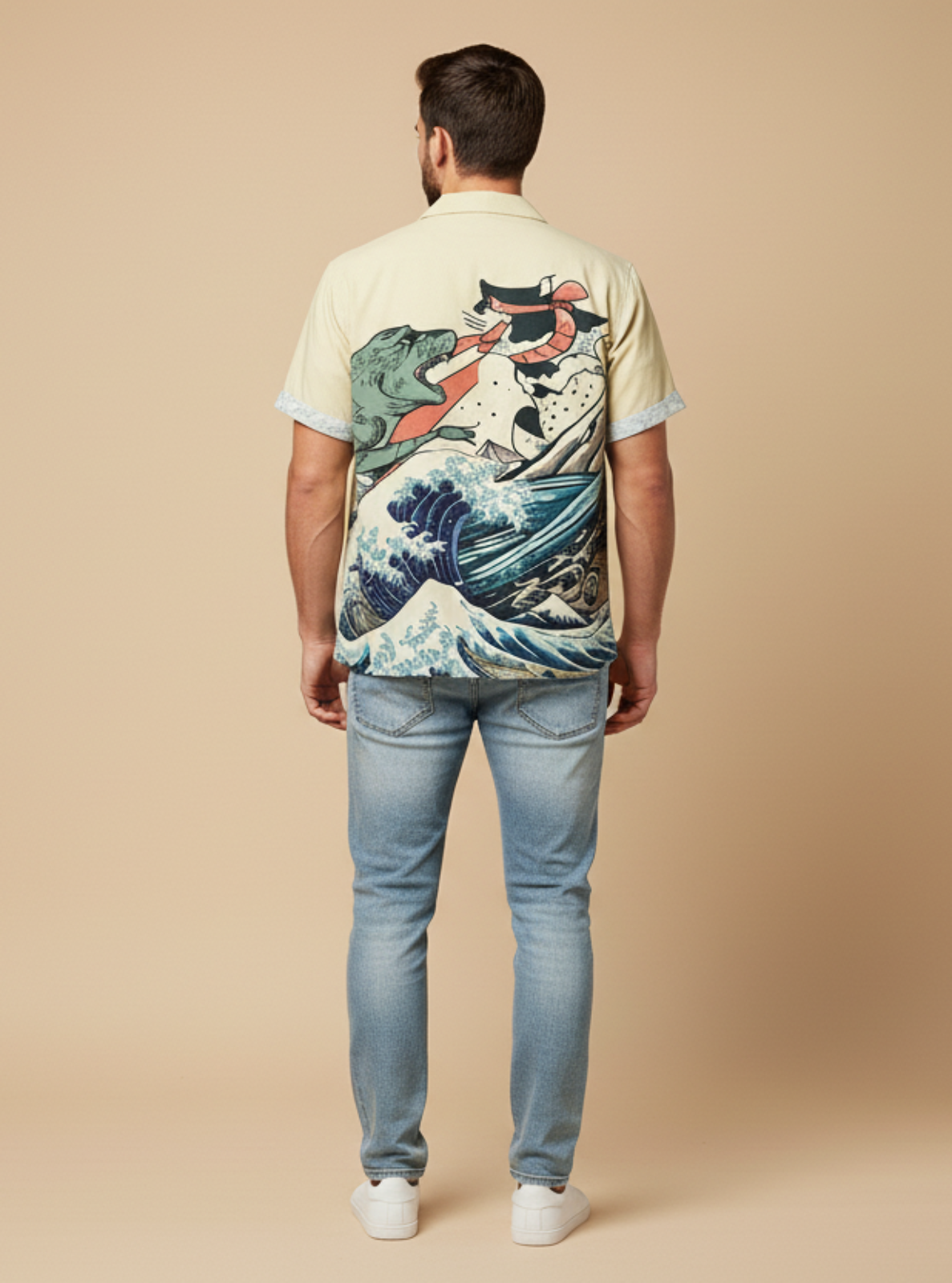 Man wearing a shirt with a colorful design on the back against a beige background