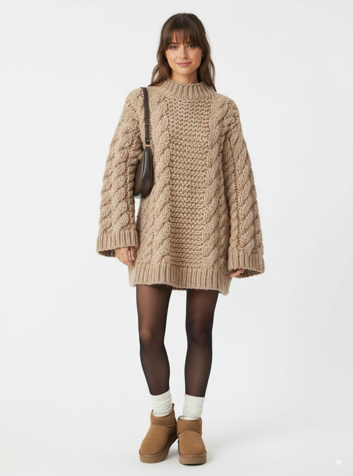 Woman wearing a beige knitted sweater dress with brown boots on a white background