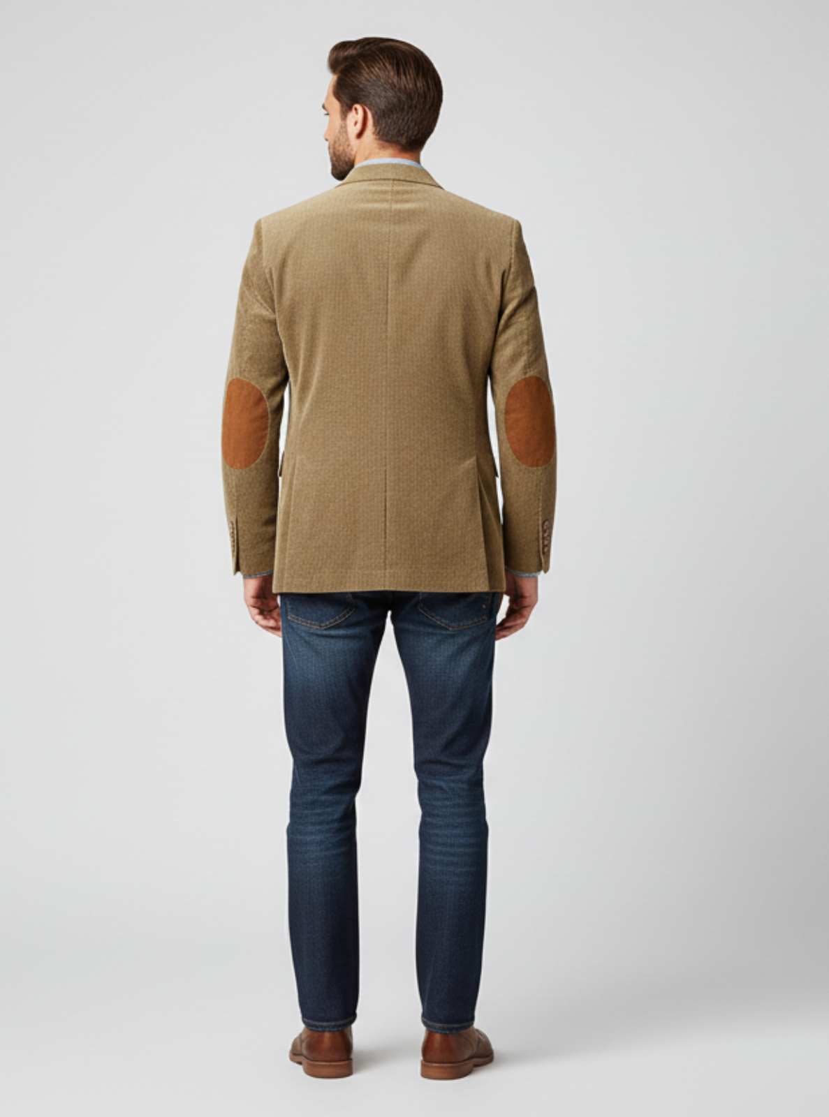 Man wearing a green jacket with brown accents on a white background