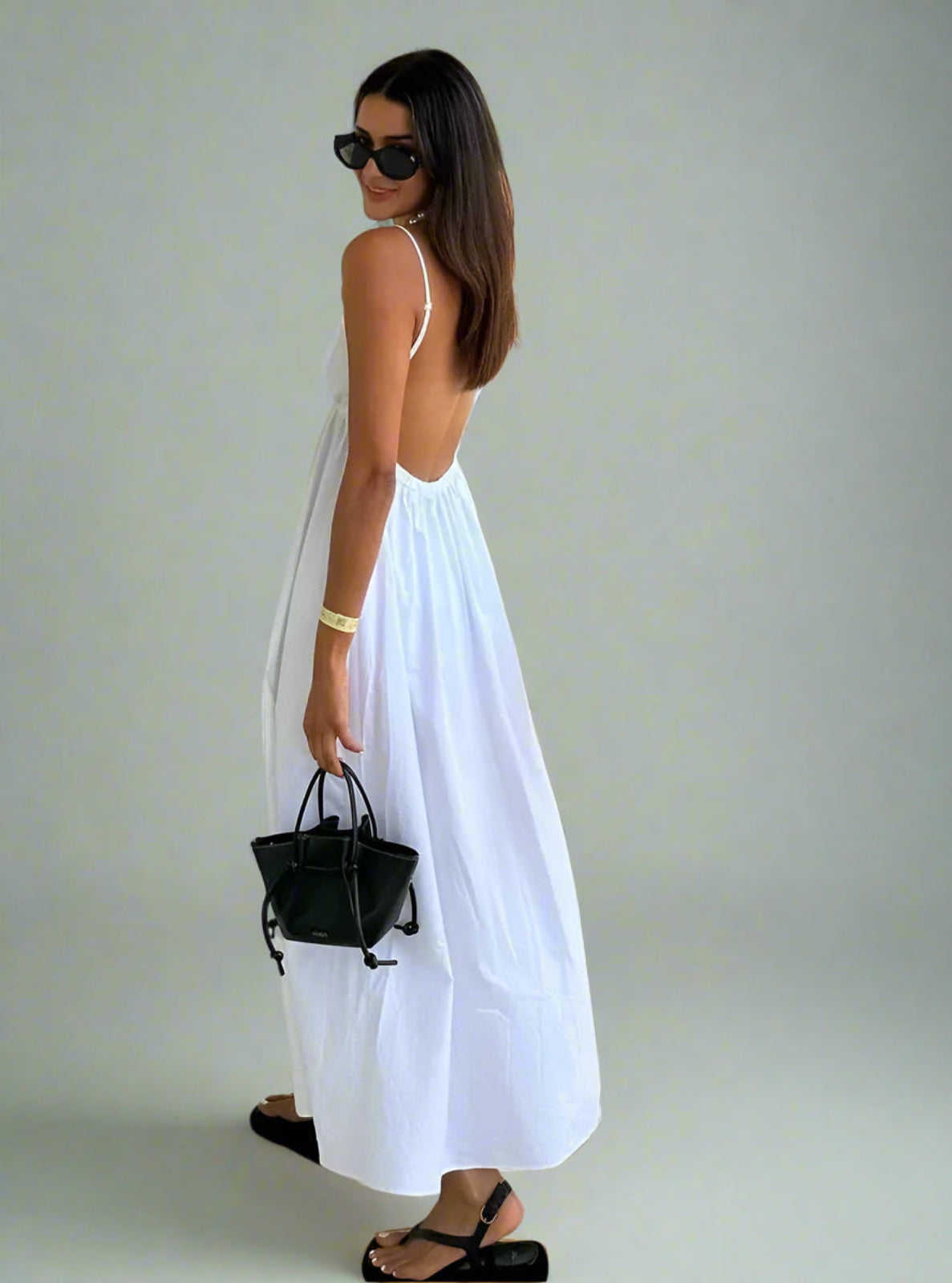 Woman in white strappy dress