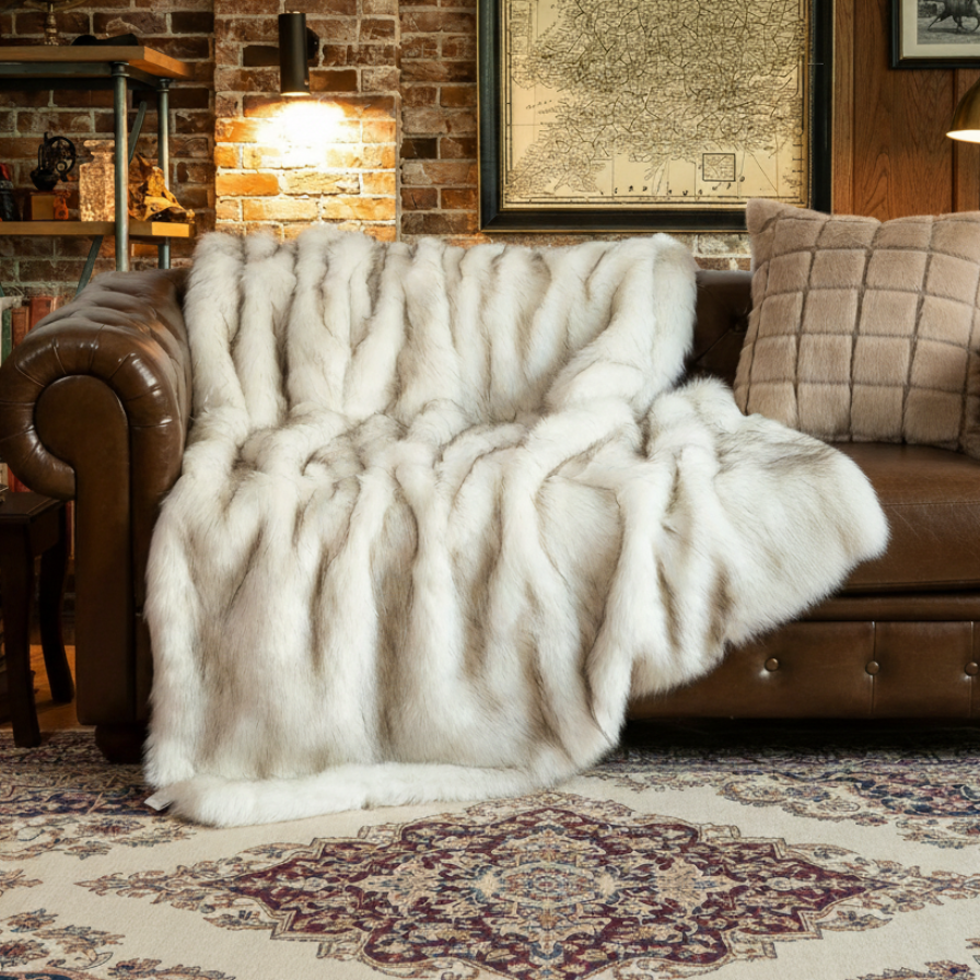 Cozy living room with brown leather sofa, white fur throw, and decorative rug.