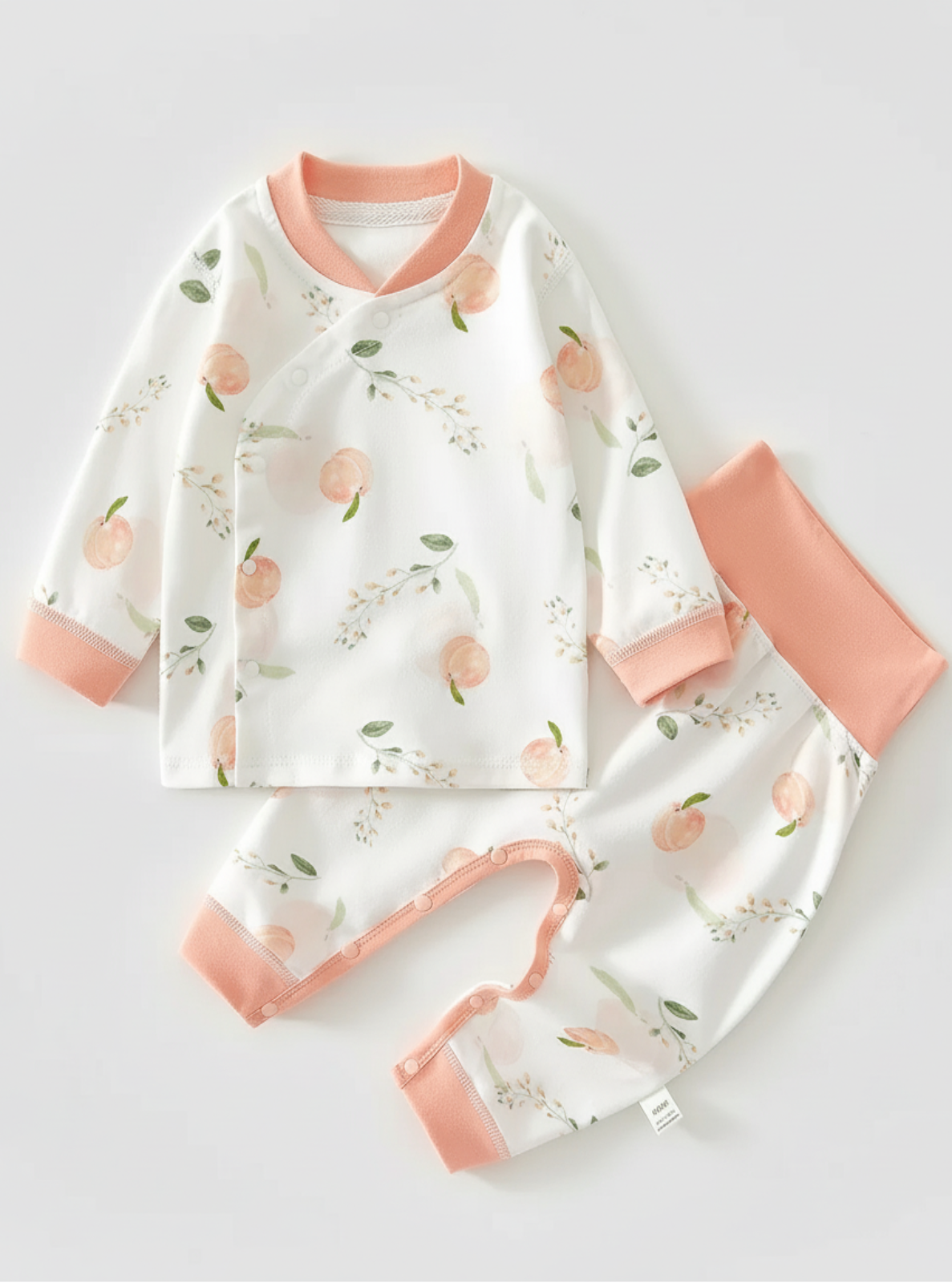 Children's pajama set with peach pattern on a light gray background