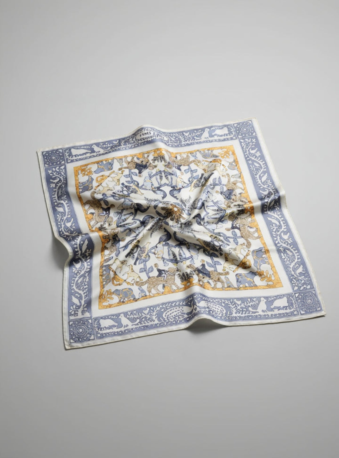 Decorative scarf with intricate patterns on a gray background