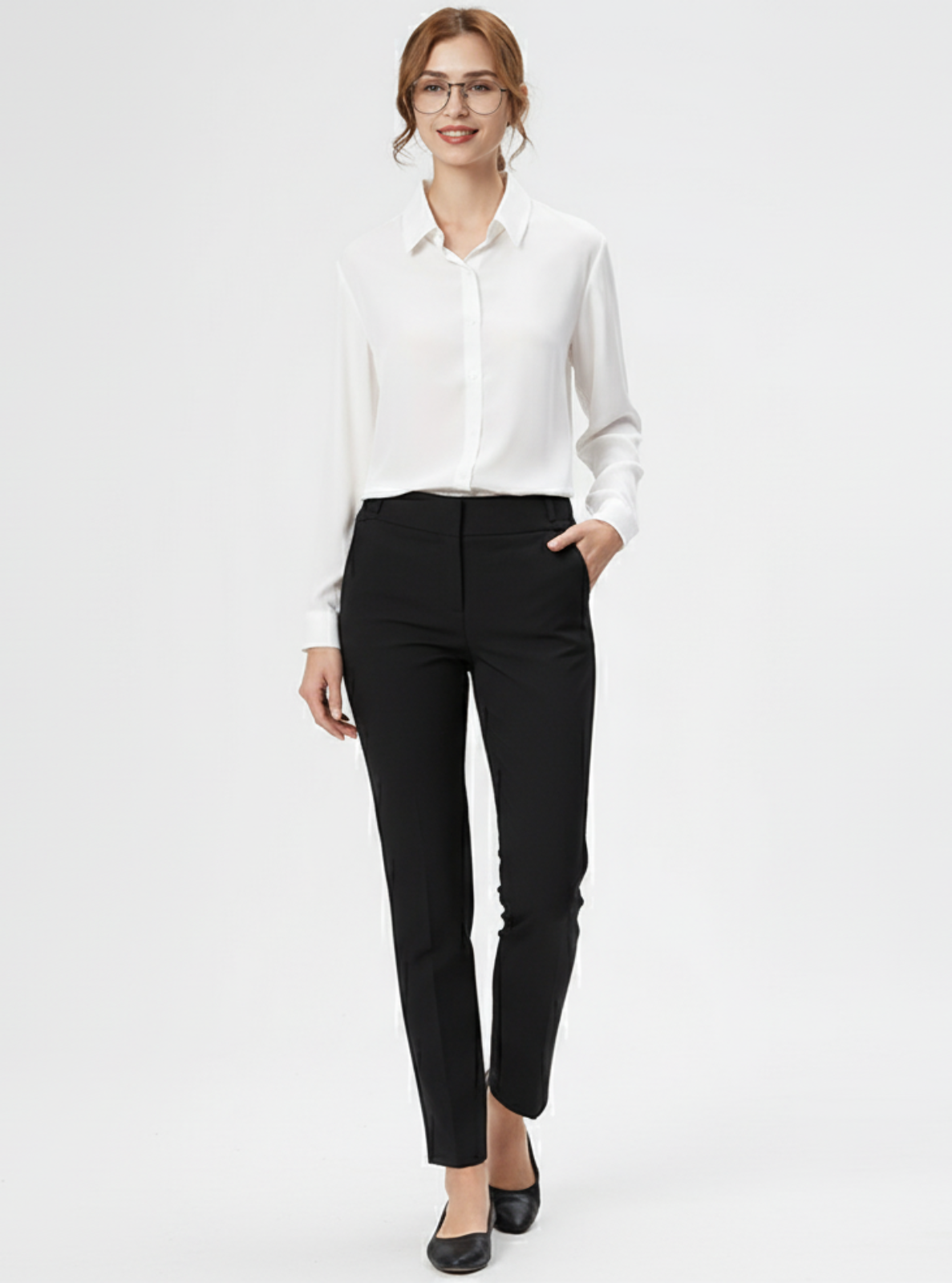 Woman wearing a white blouse and black pants on a white background
