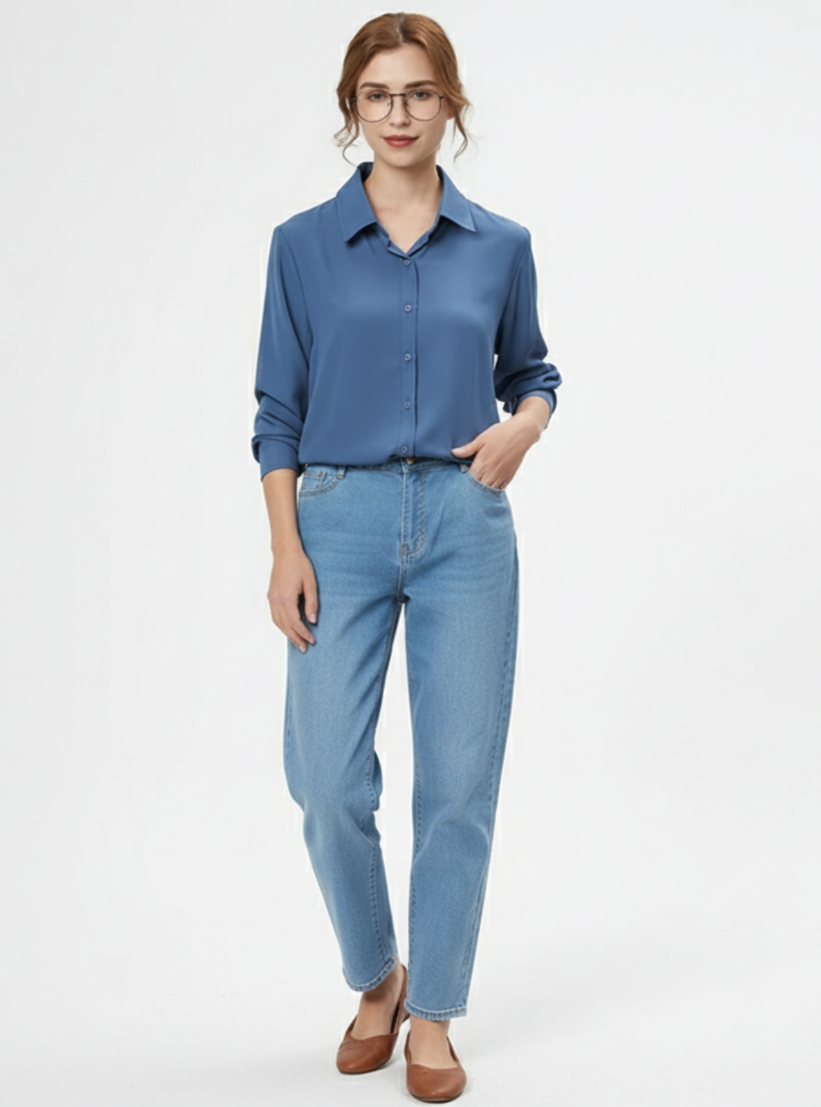 Woman wearing a blue shirt and jeans on a white background