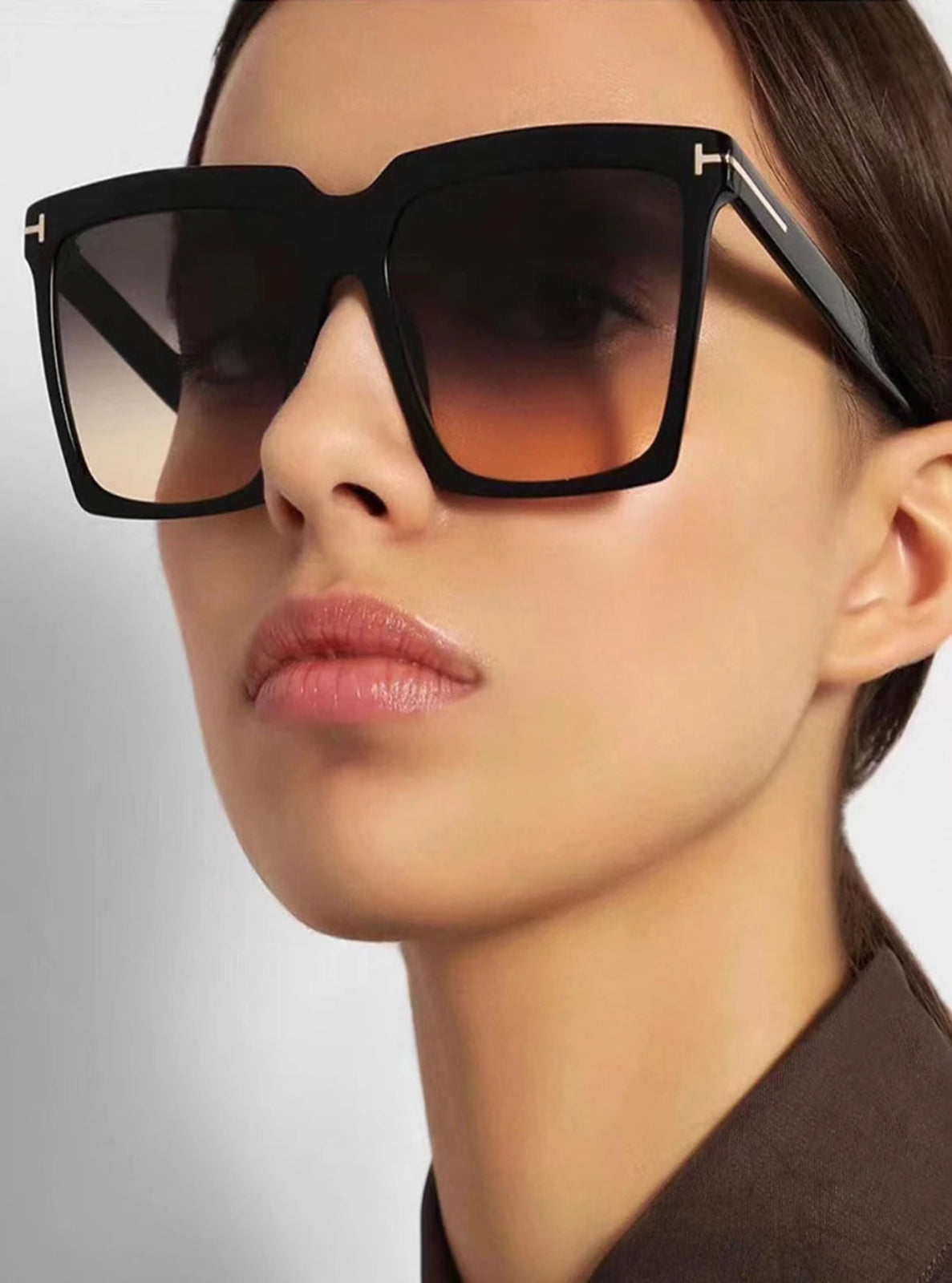 Close-up of a person wearing black sunglasses