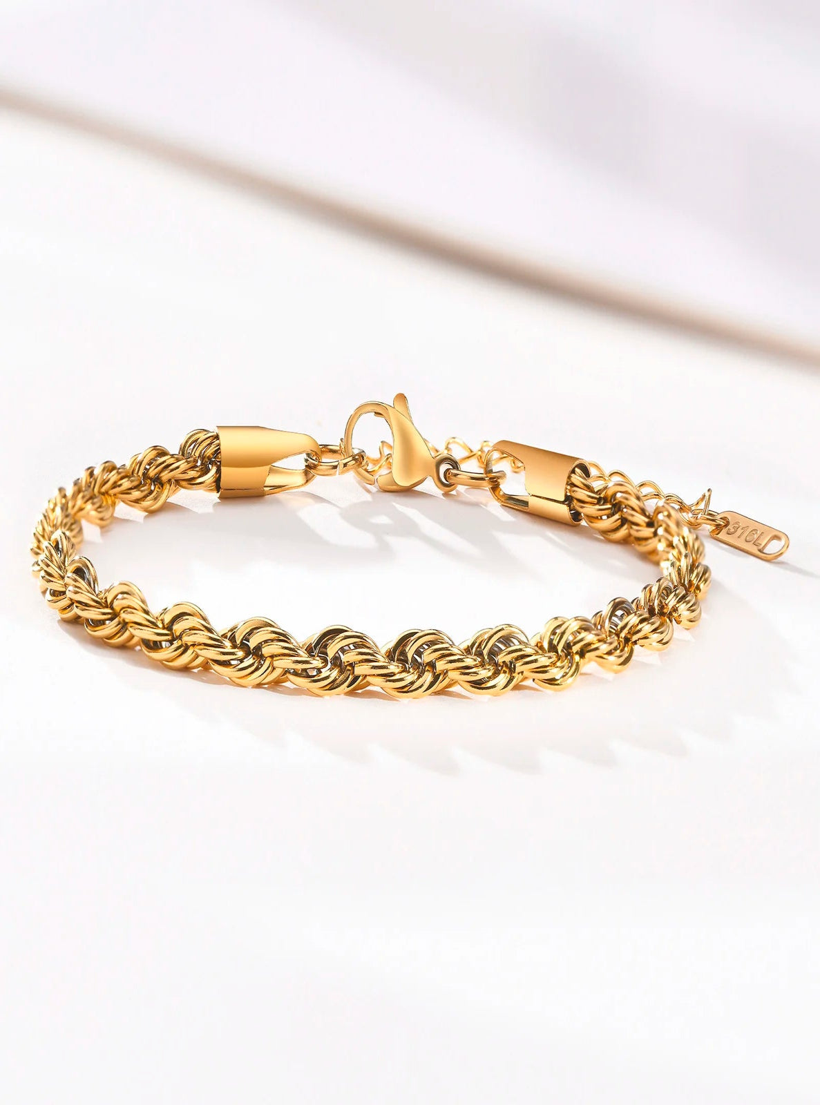 Gold bracelet on a white background