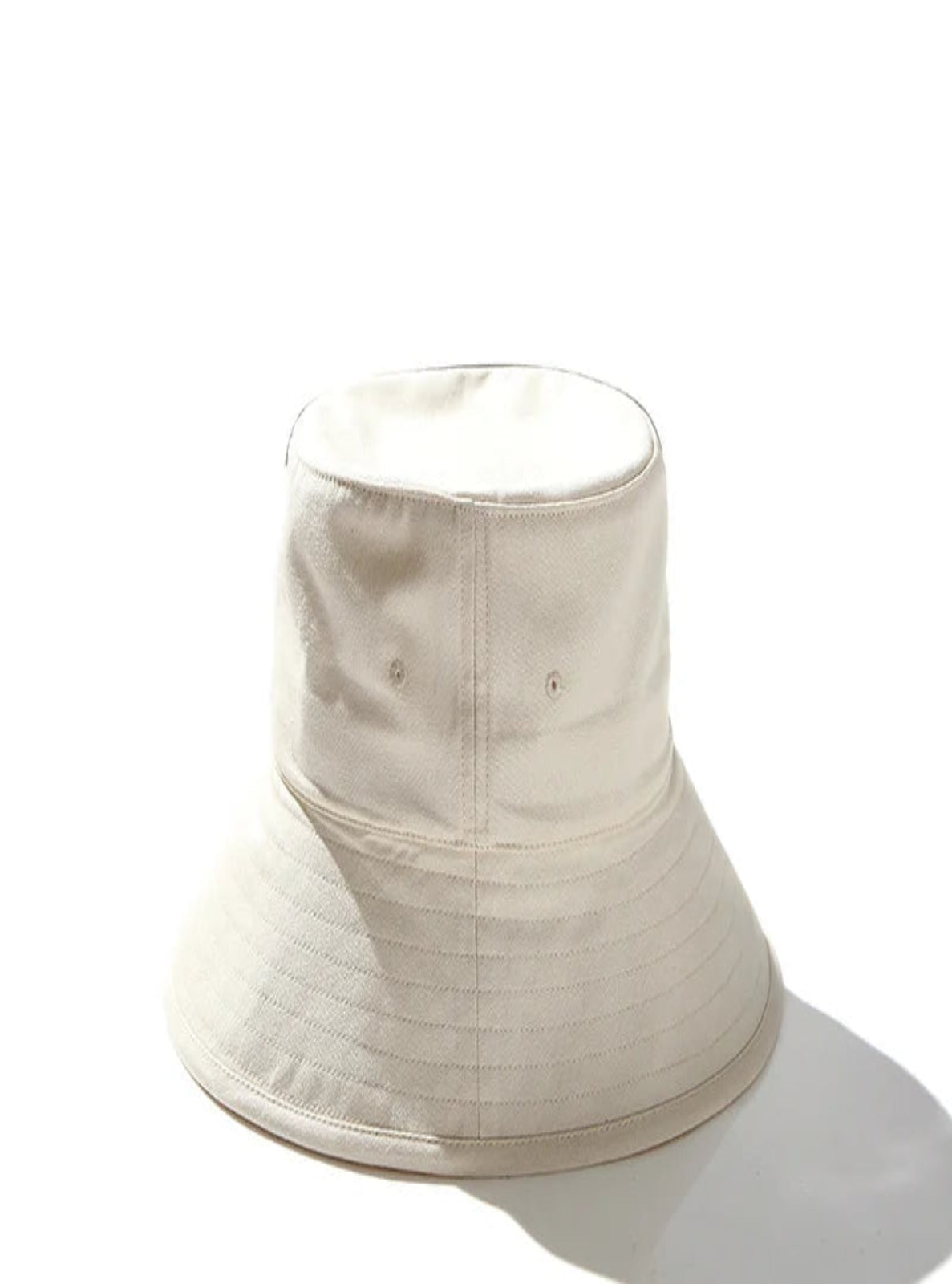 Beige bucket hat on a white background.