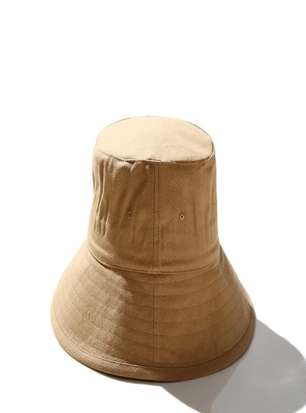 Beige bucket hat on a white background.