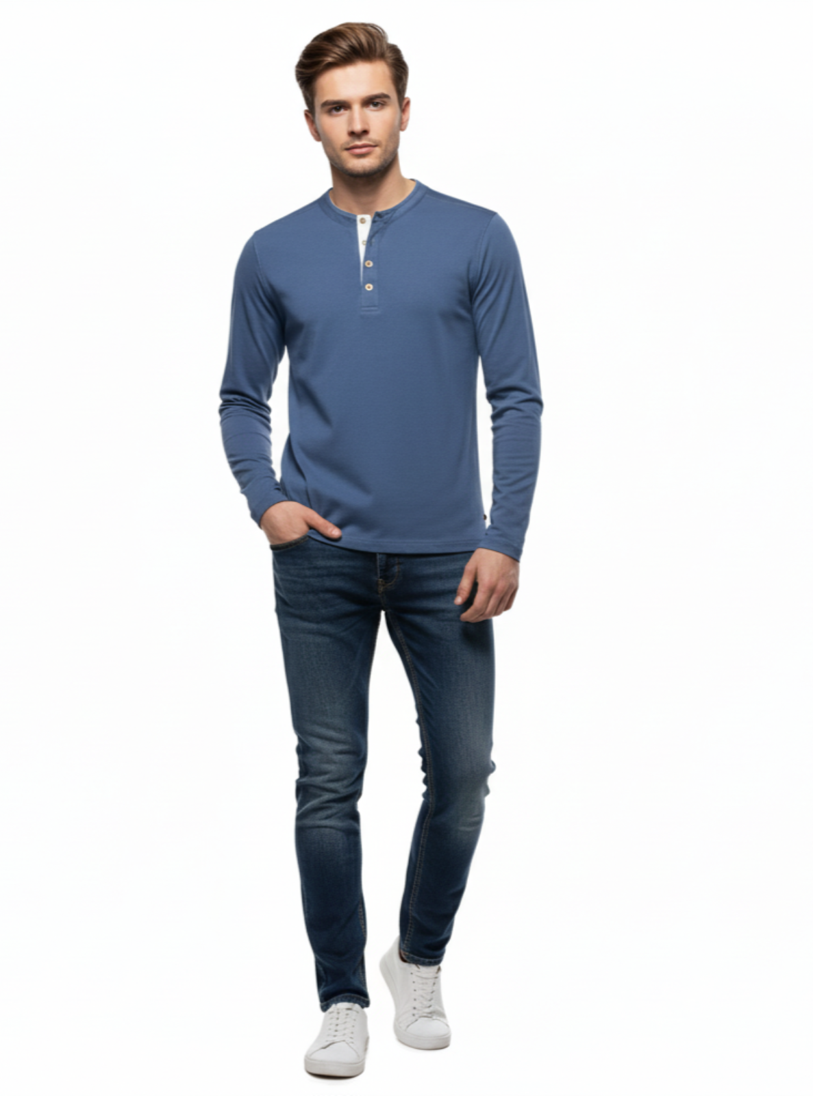 Man wearing a blue long-sleeve shirt and jeans on a white background