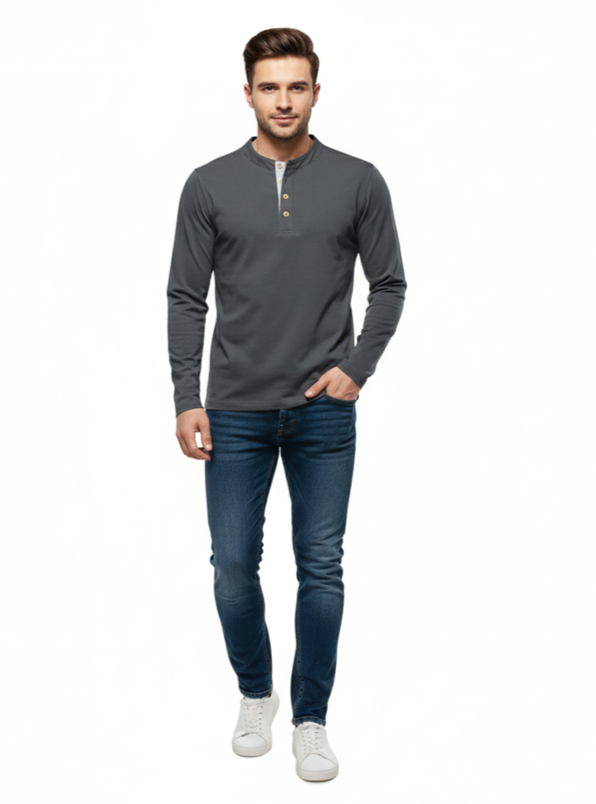 Man wearing a gray long-sleeve shirt and blue jeans on a white background