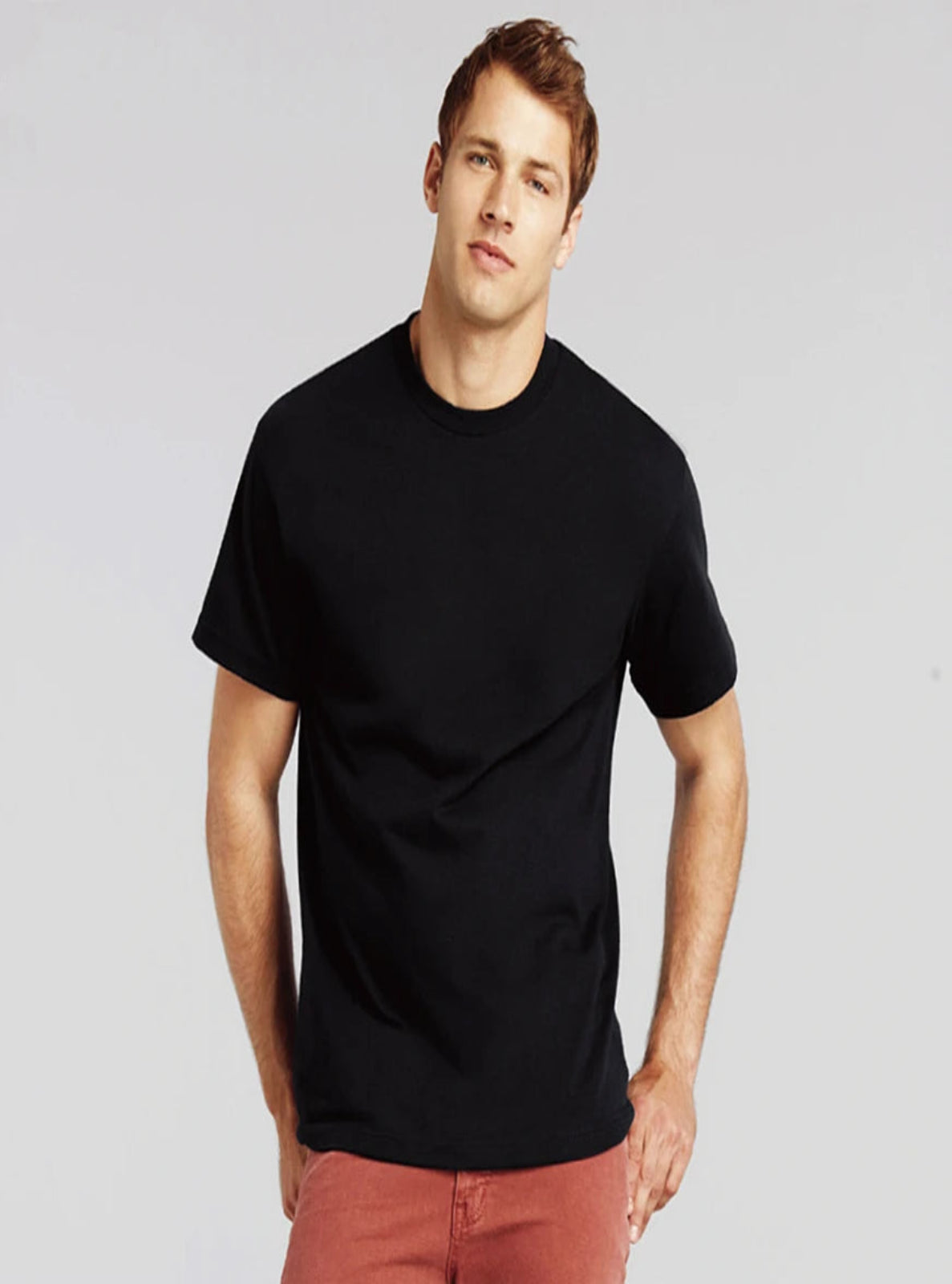 Man wearing a black t-shirt against a plain background
