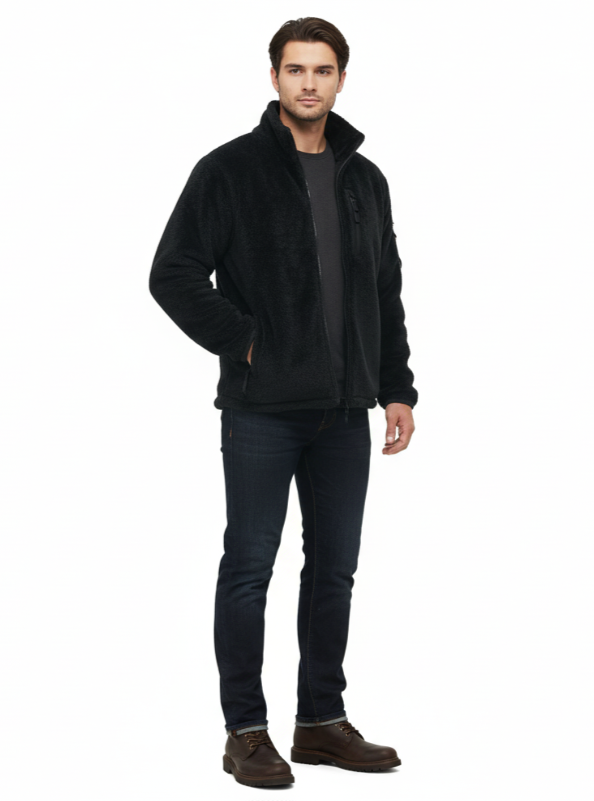 Man wearing a black jacket, dark jeans, and brown boots on a white background