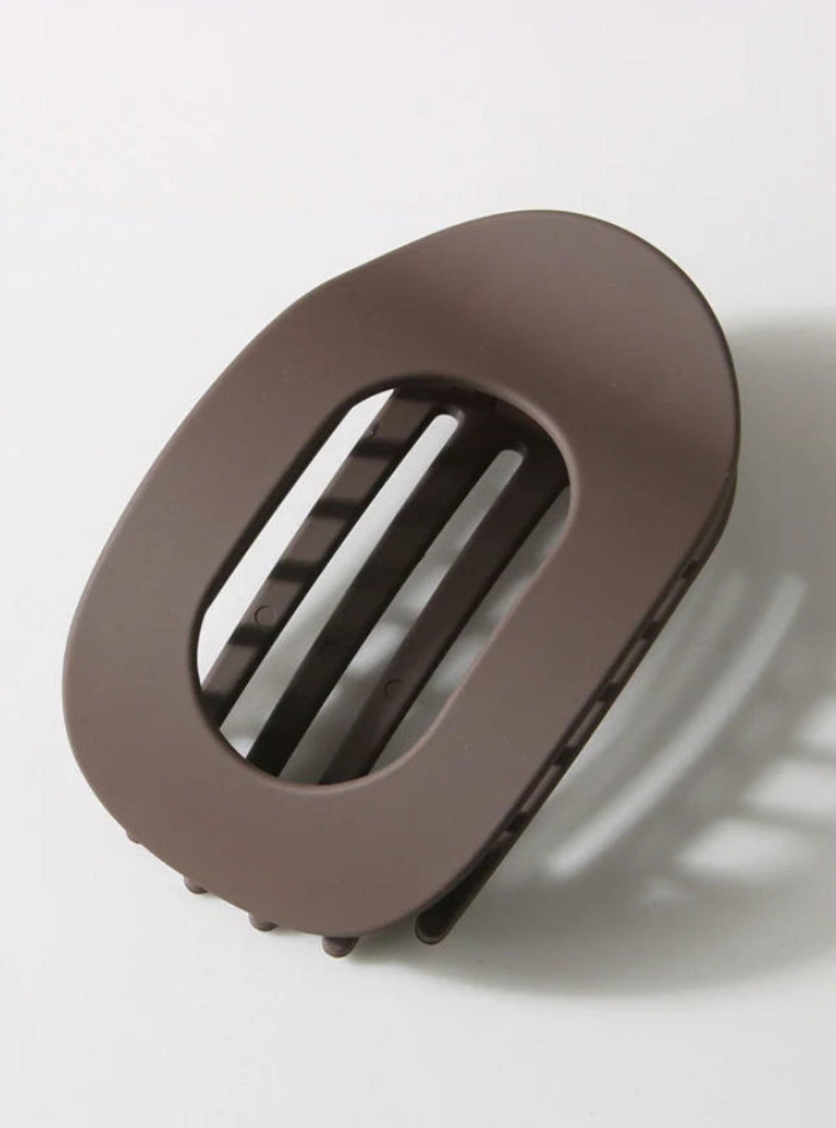 Brown hair clip on a white background