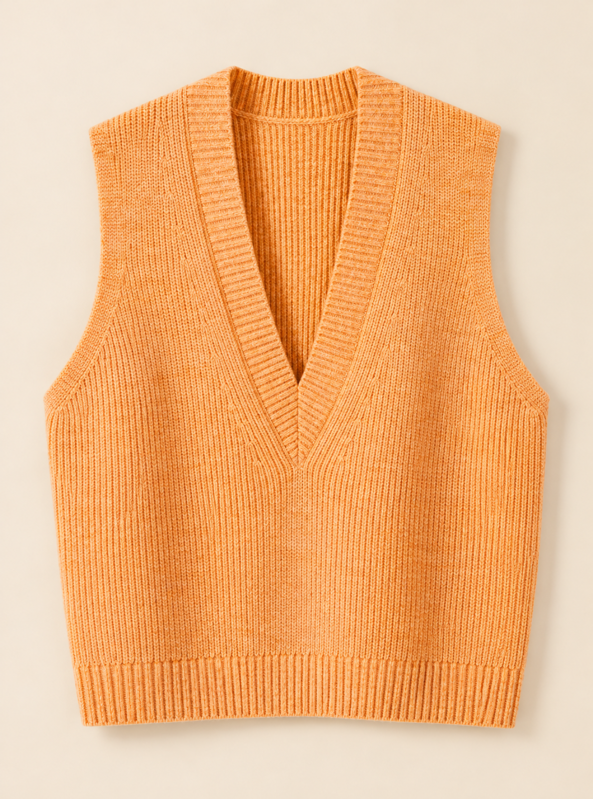 A sleeveless ribbed knit vest in a warm orange color, featuring a V-neckline, shown flat against a light beige background.