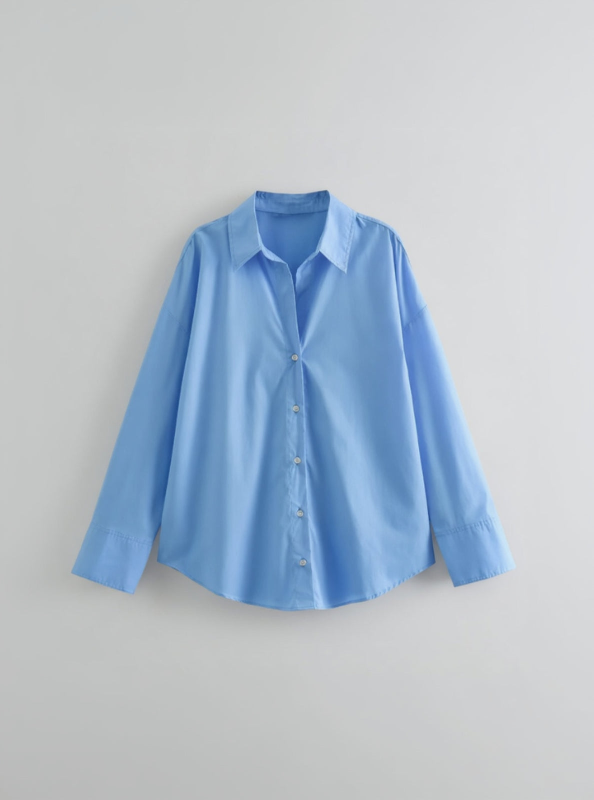Blue shirt on a gray background