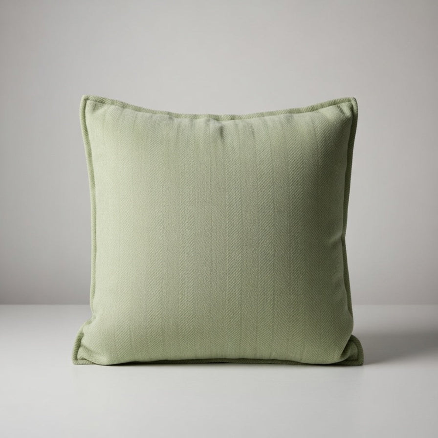 Green pillow on a light gray background