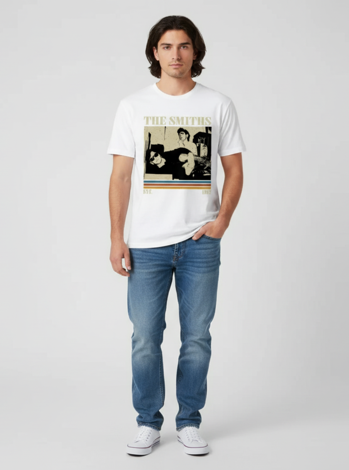 Person wearing a white t-shirt with 'The Smiths' band graphic on a plain background