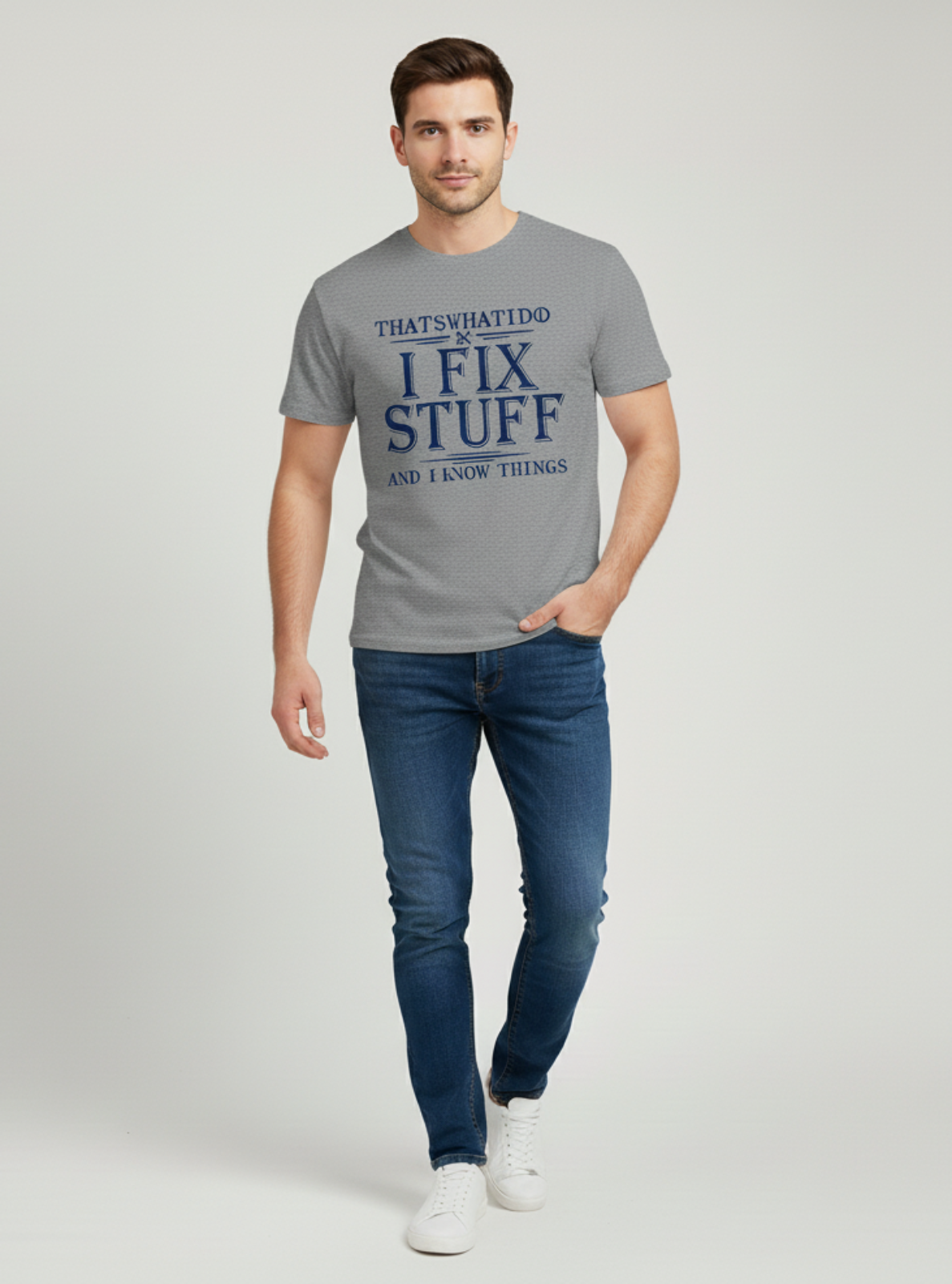 Man wearing a gray t-shirt with text on a plain background