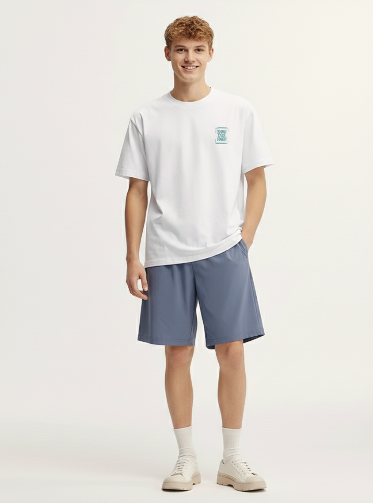 Person wearing a white t-shirt and blue shorts on a plain background