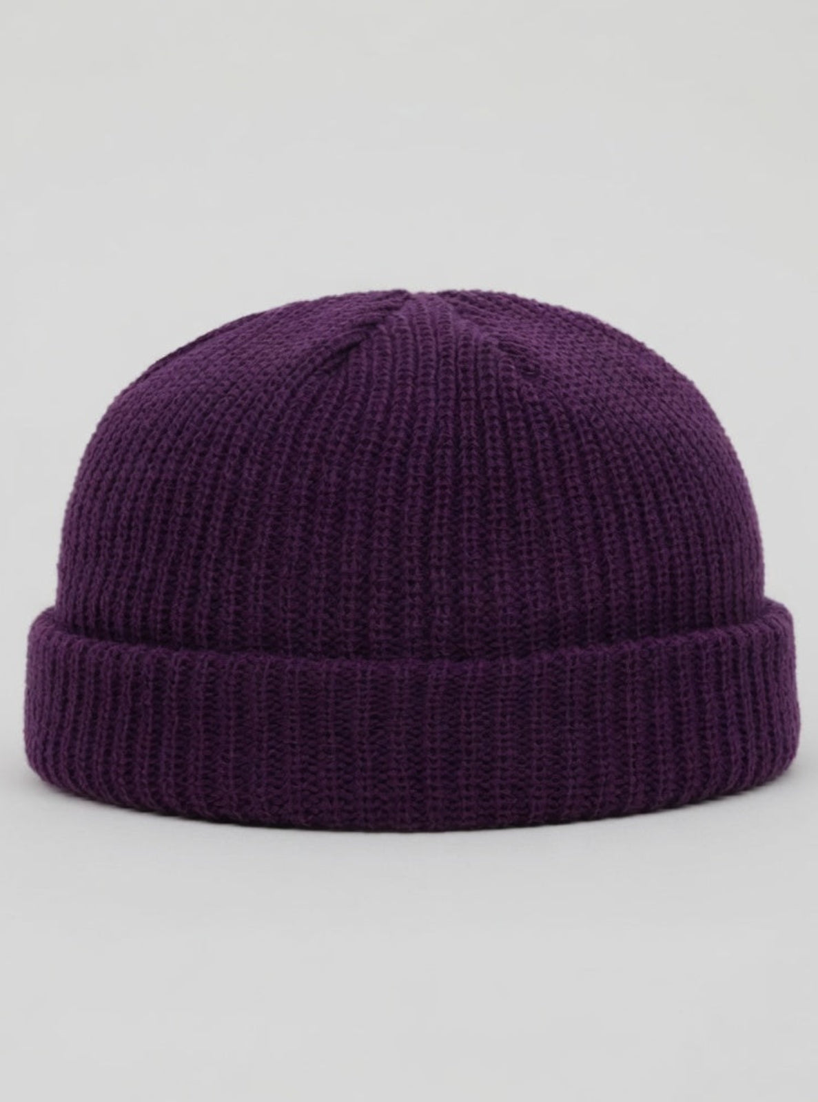 Purple knit beanie on a light gray background