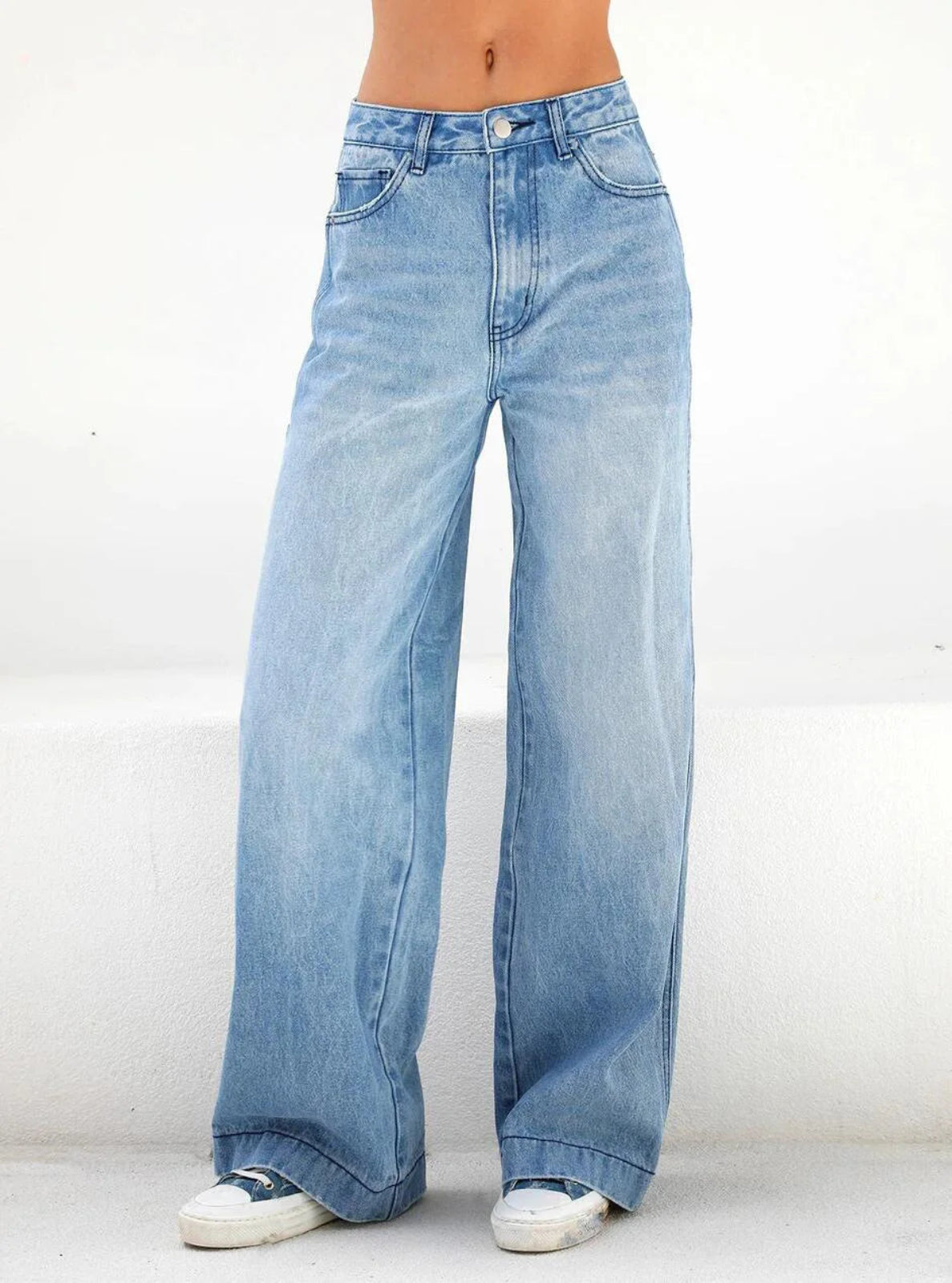 Light blue wide-leg jeans on a white background