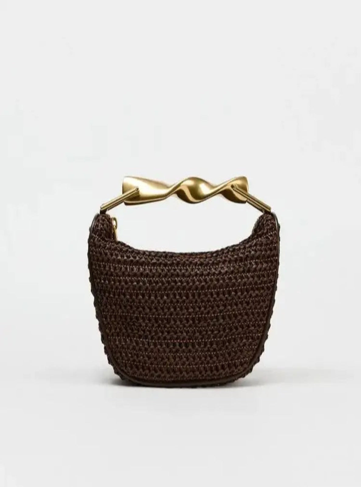 Brown woven handbag with a gold handle on a white background