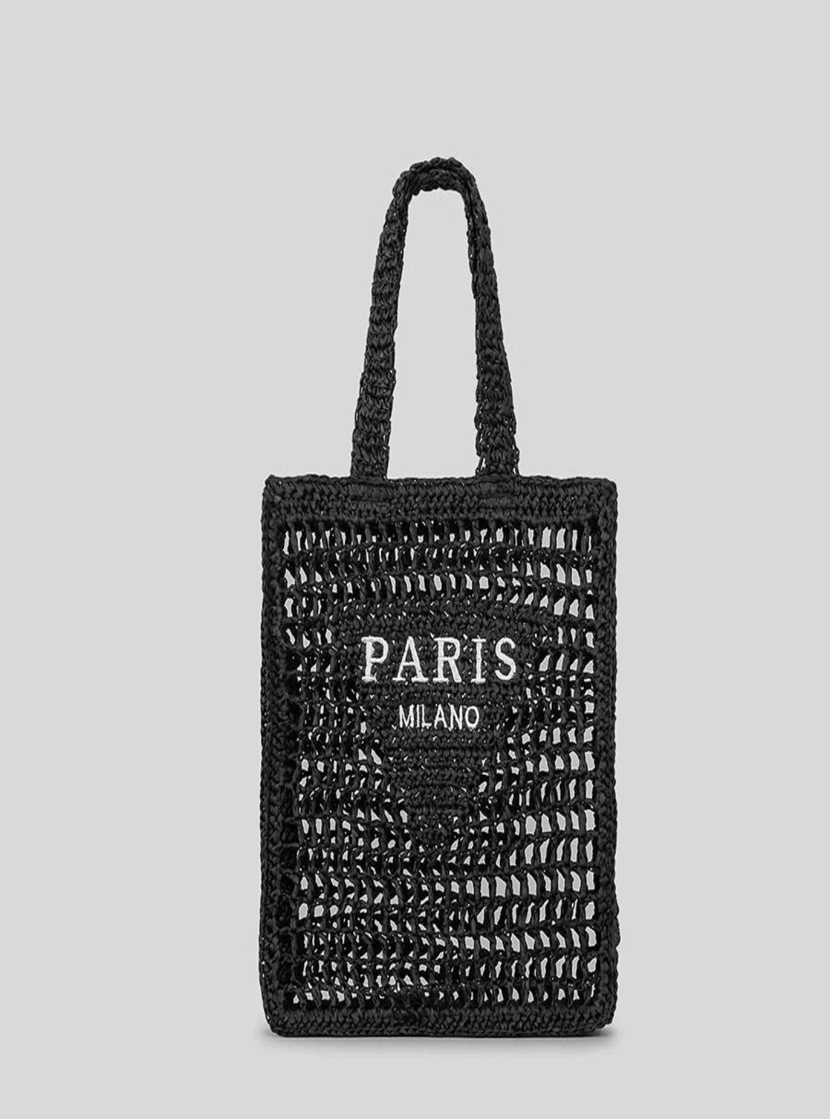 Black woven tote bag with 'PARIS MILANO' text on a gray background