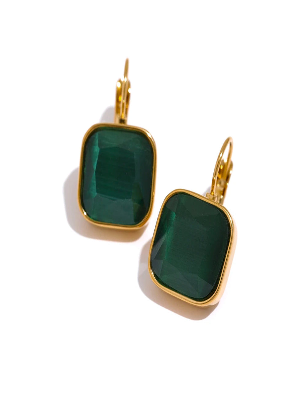 Green square stone earrings with gold accents on a white background