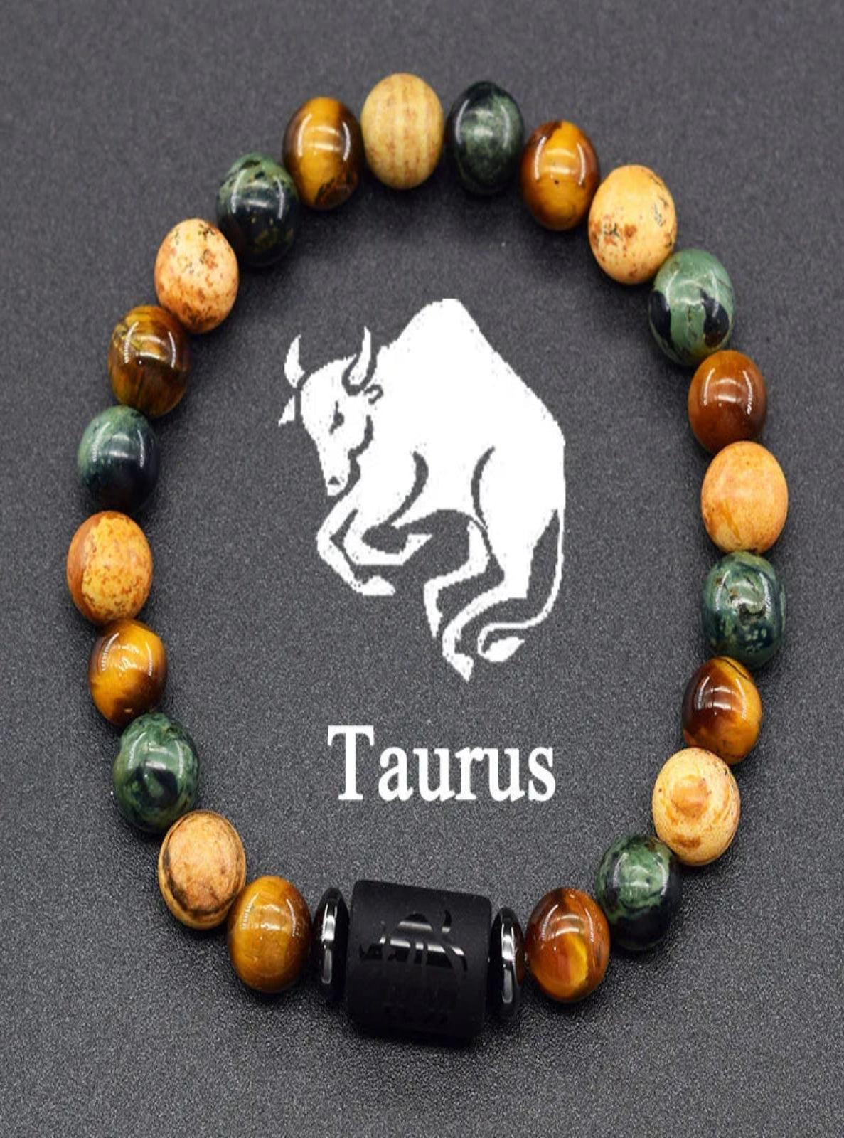 Beaded bracelet with Taurus symbol on a dark background