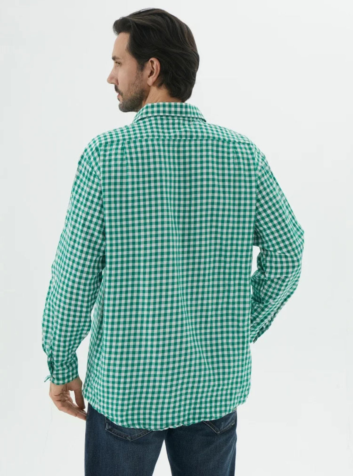 Man wearing a green checkered shirt on a white background