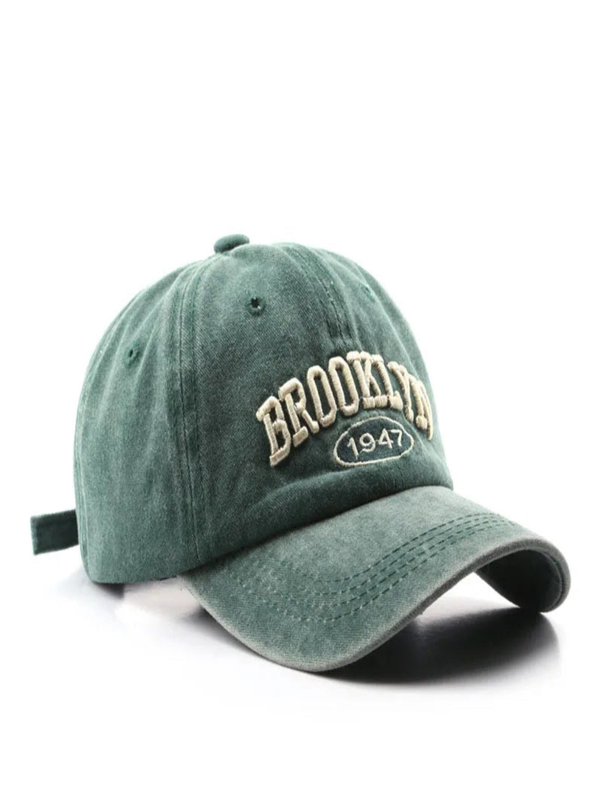 Green baseball cap with 'Brooklyn 1947' embroidery on a white background