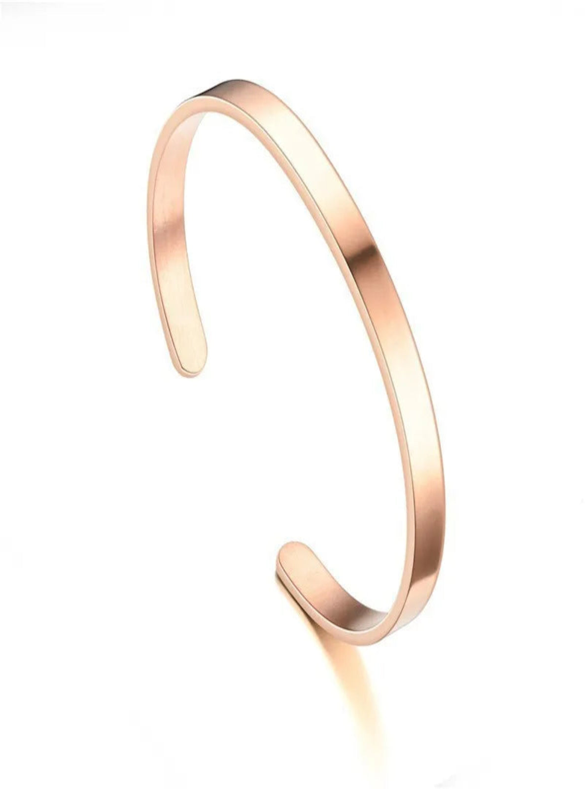 Rose gold bangle on a white background