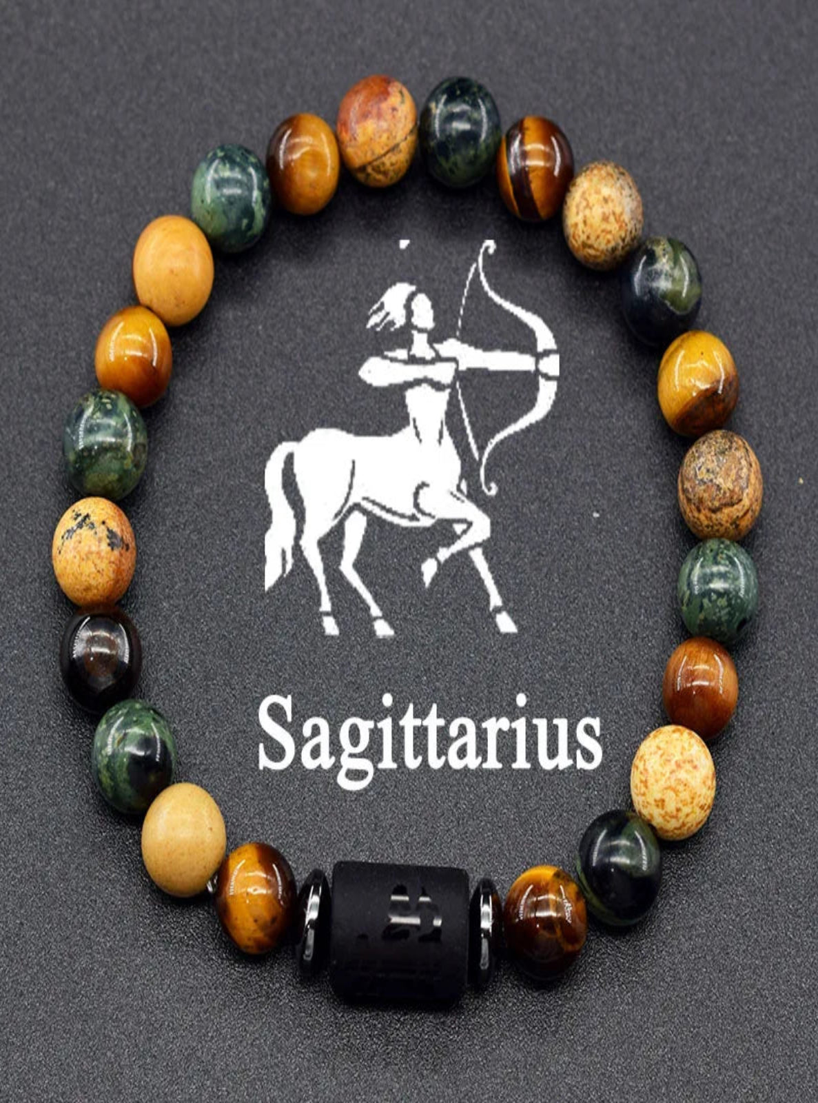 Multicolored beaded bracelet with Sagittarius symbol on a dark background