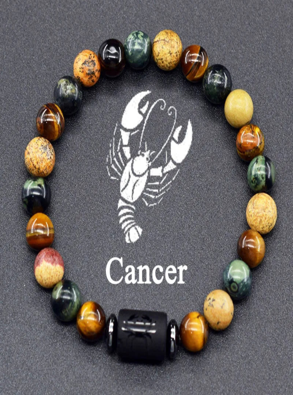 Multicolored beaded bracelet with a Cancer zodiac symbol on a dark background