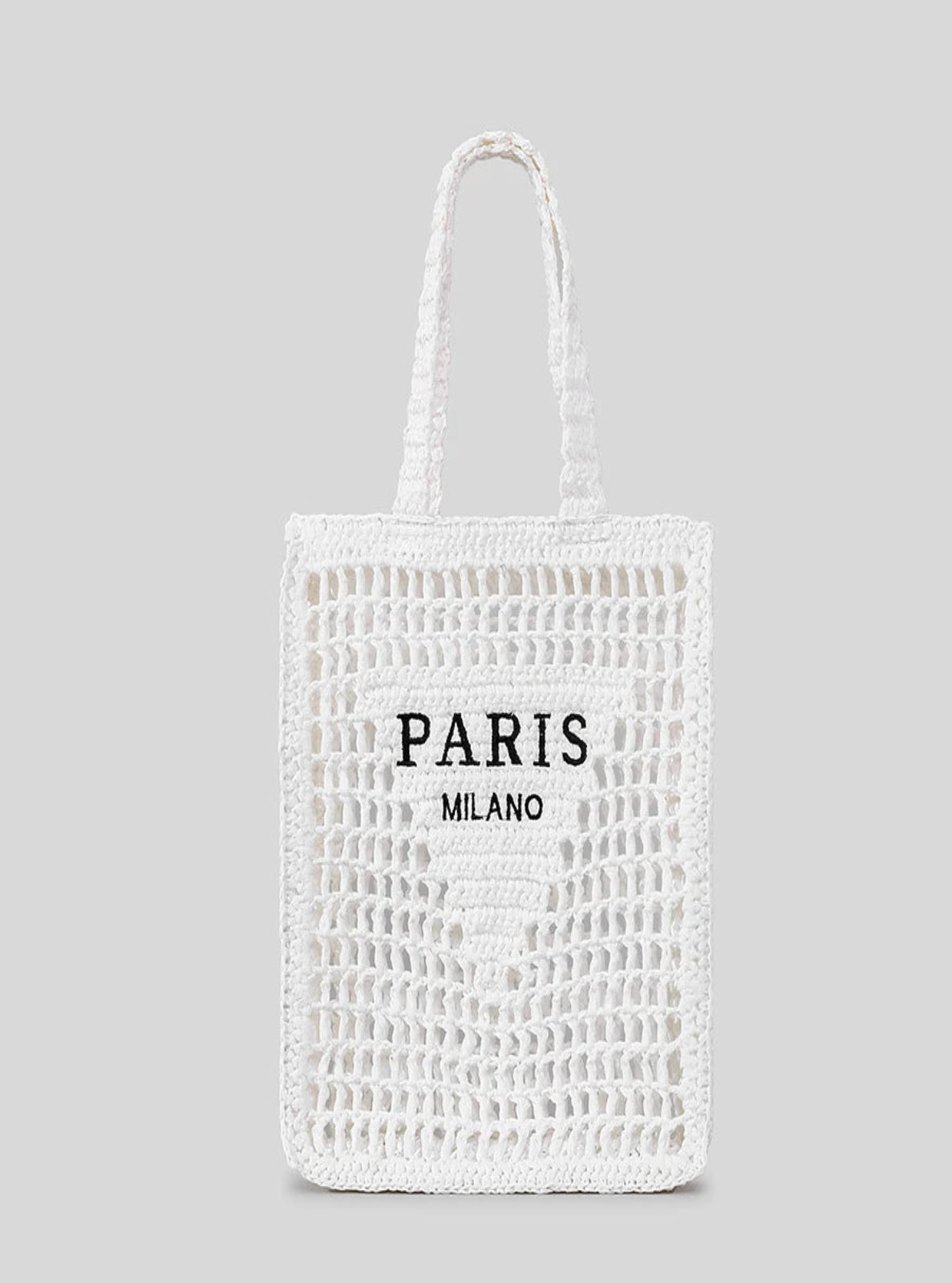 White woven tote bag with 'PARIS MILANO' text on a gray background