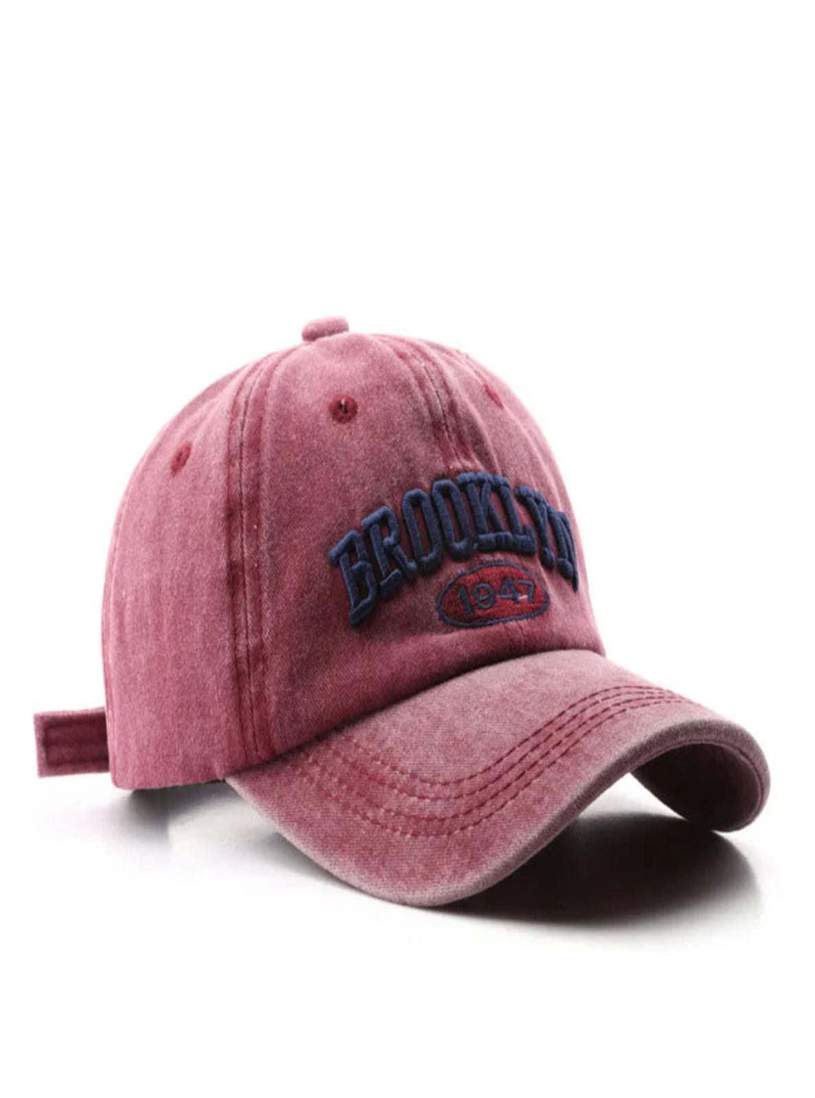 Red baseball cap with 'Brooklyn' text on a white background