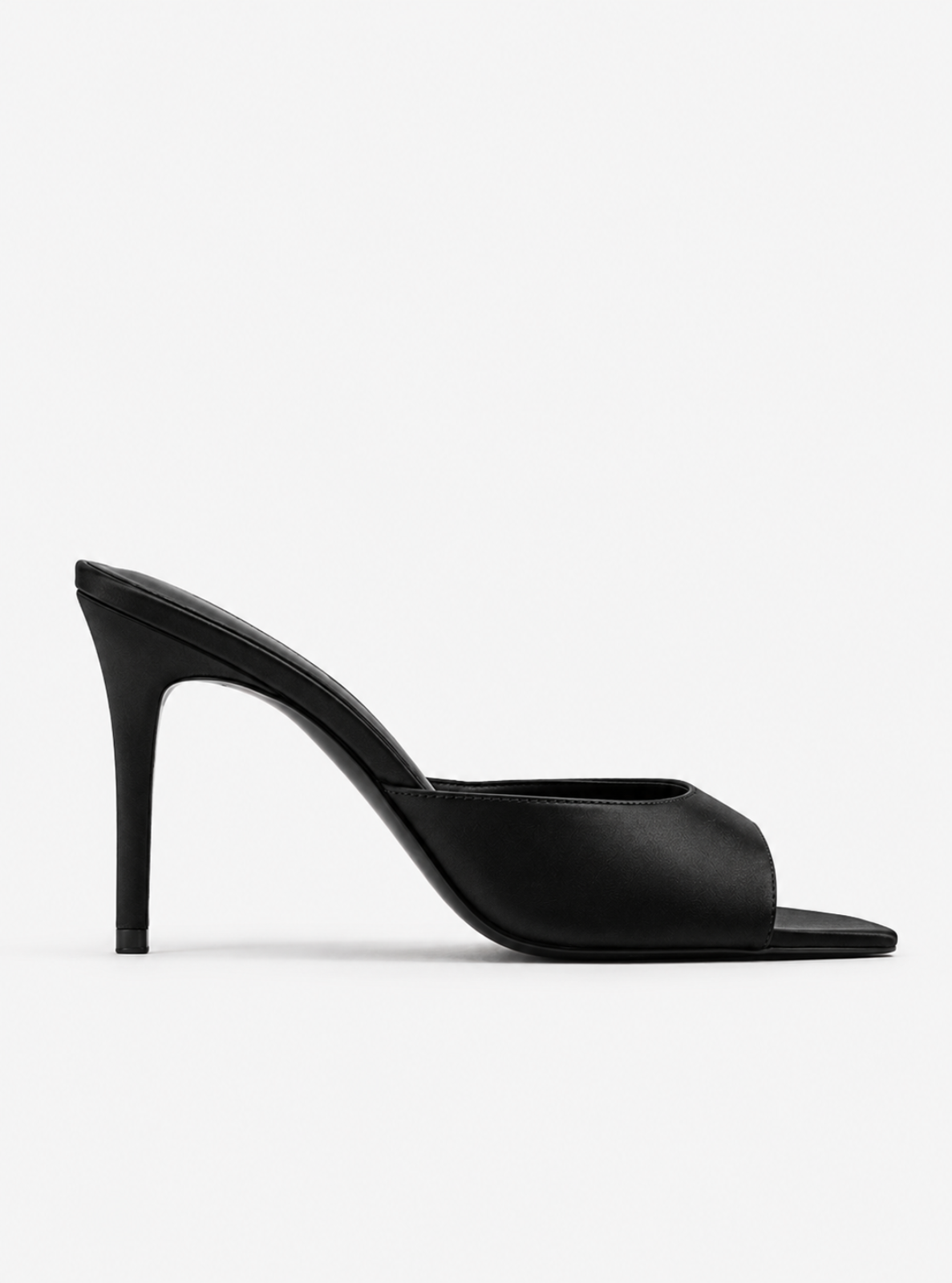 A single black leather high-heeled mule sandal with a pointed toe and slingback design, shown in profile against a light gray background.