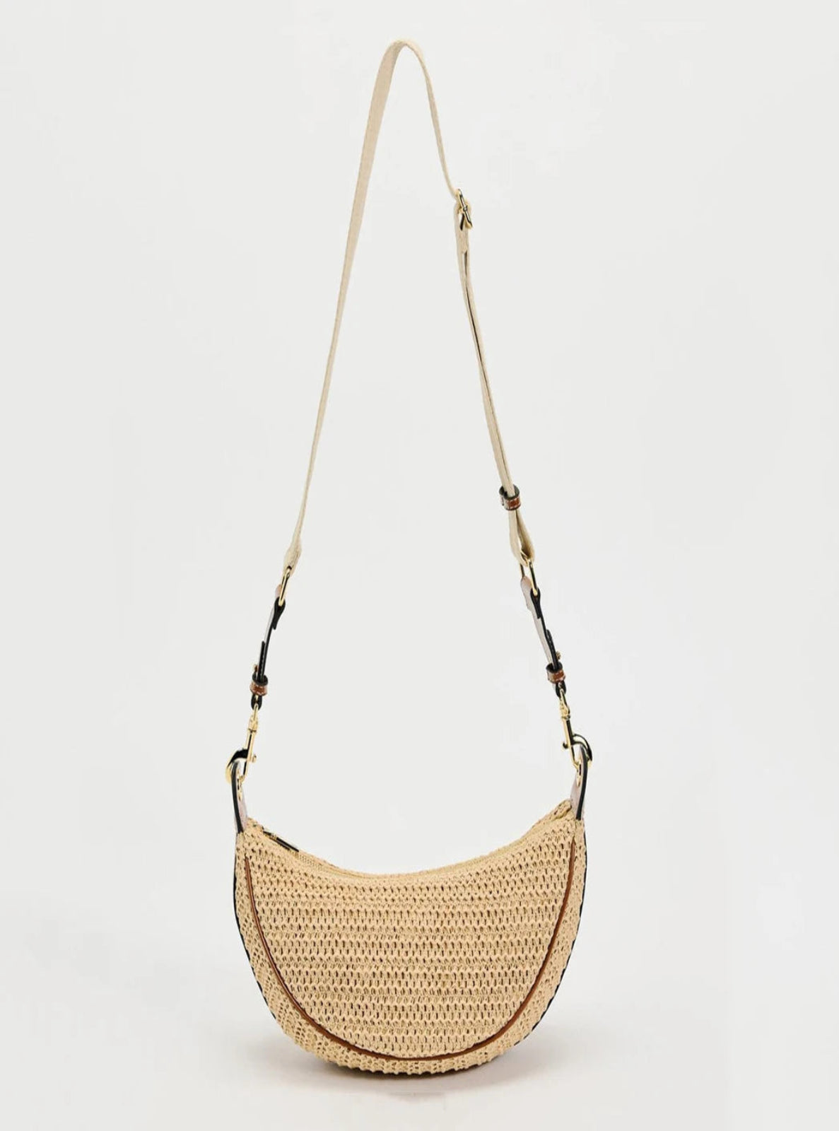 Woven handbag with a strap on a light gray background