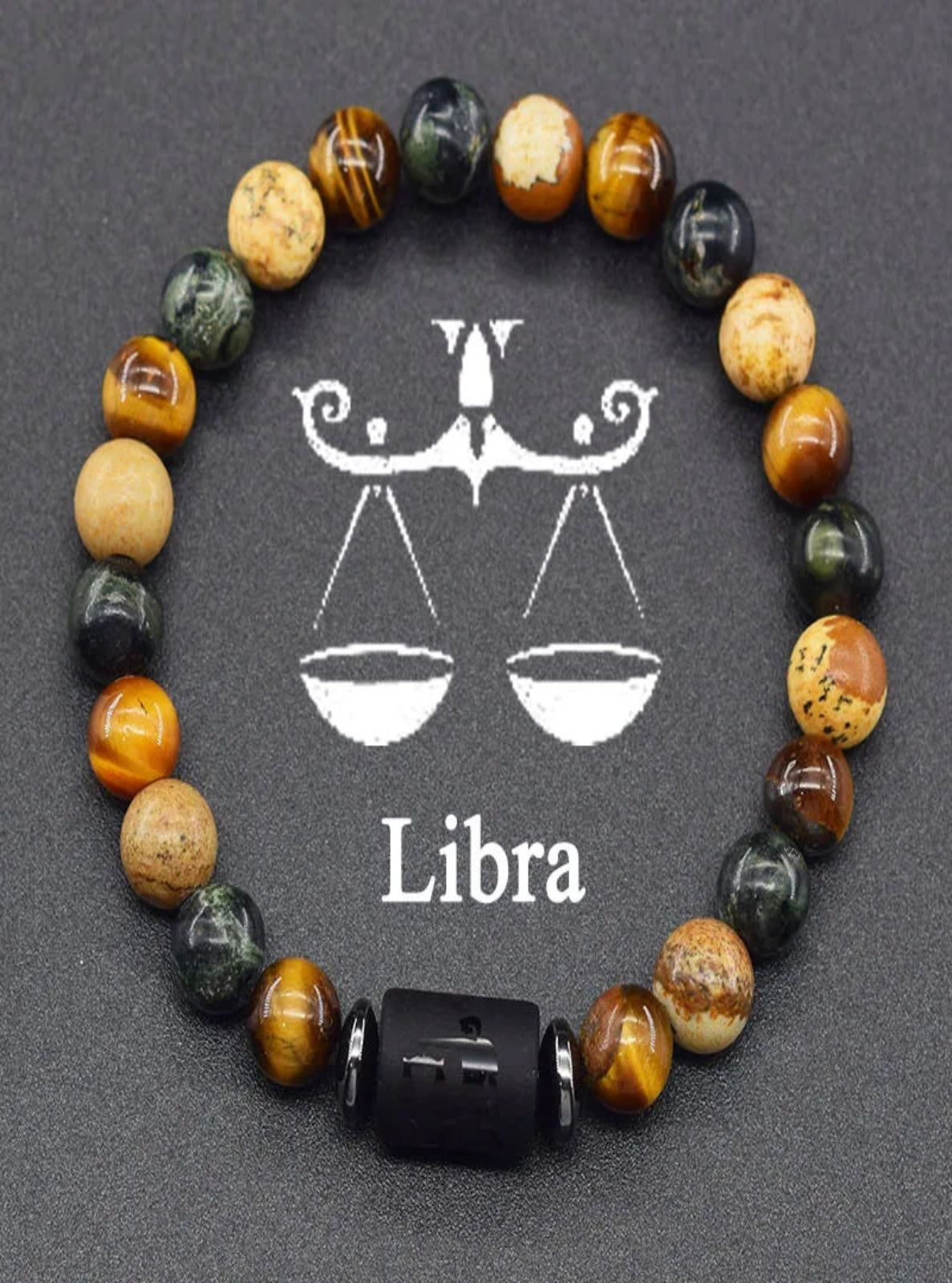 Beaded bracelet with Libra symbol on a dark background