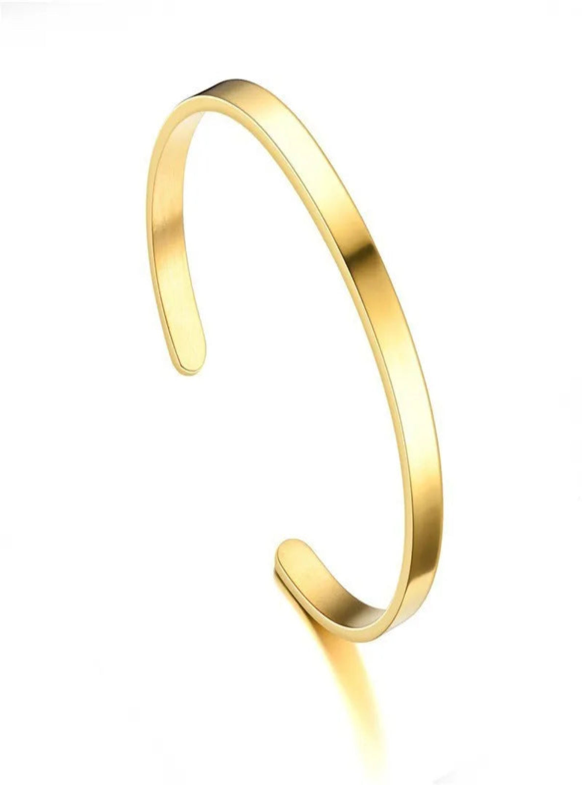 Gold bangle on a white background