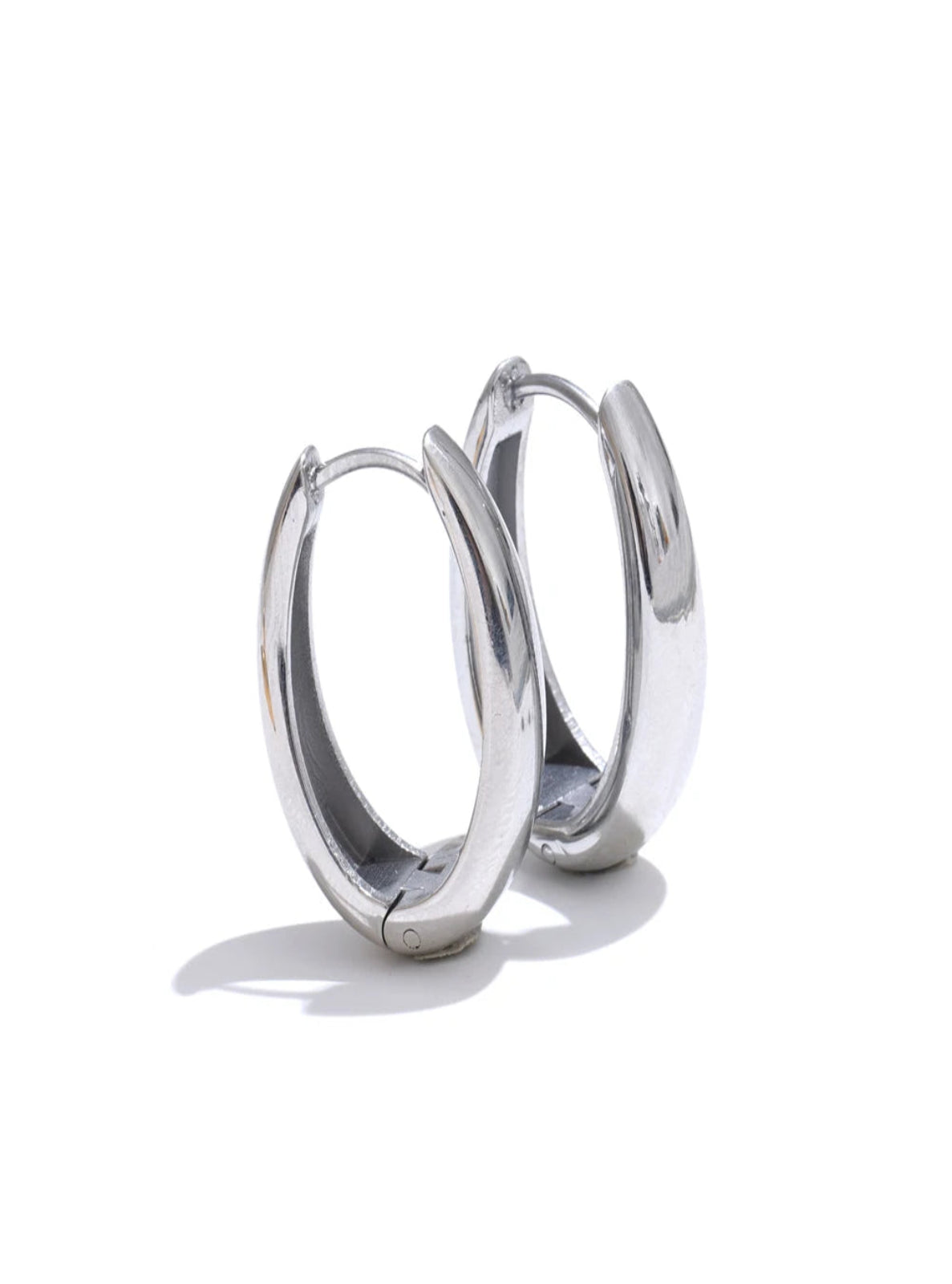 Pair of silver hoop earrings on a white background