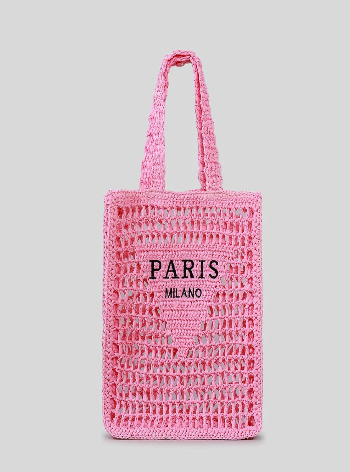 Pink woven tote bag with 'PARIS MILANO' text on a gray background