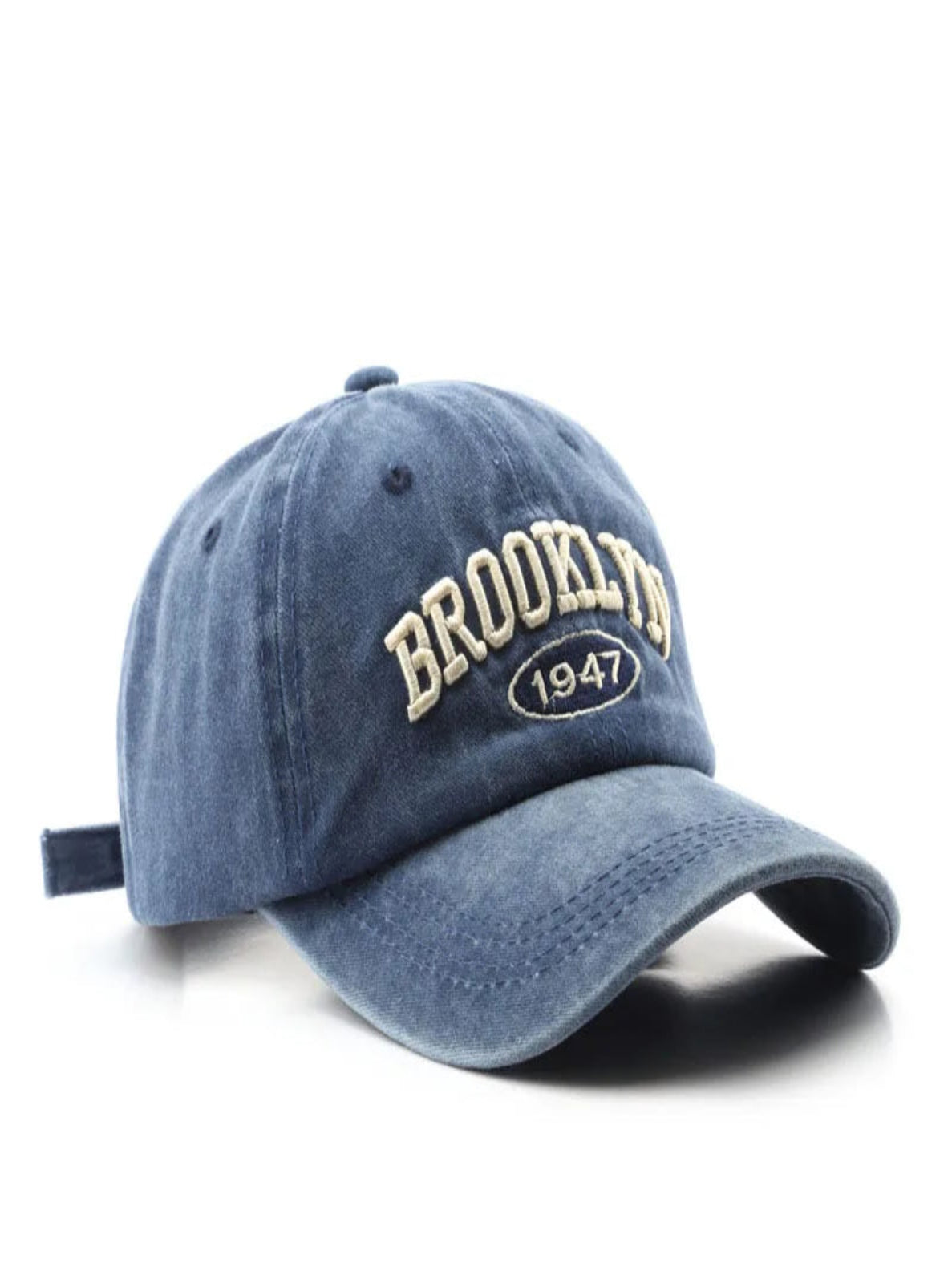 Blue cap with 'Brooklyn 1947' text on a white background