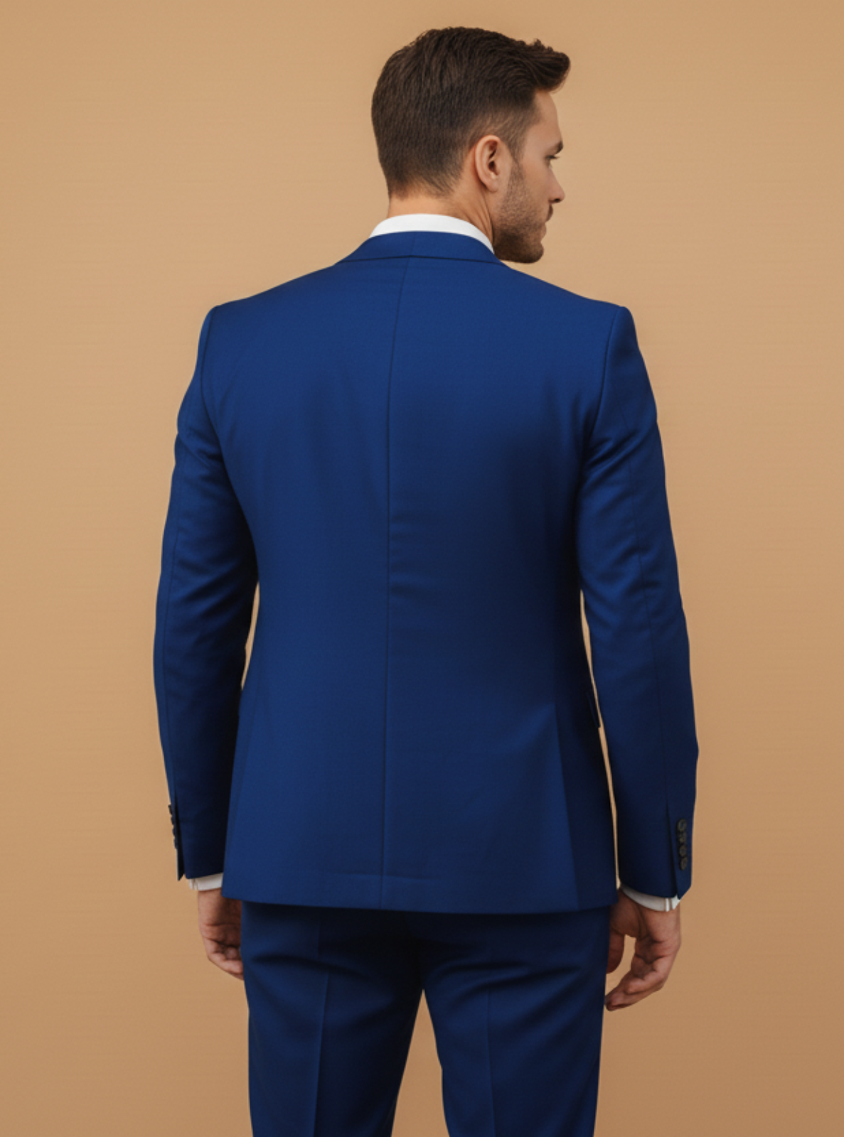 Man wearing a blue suit against a beige background