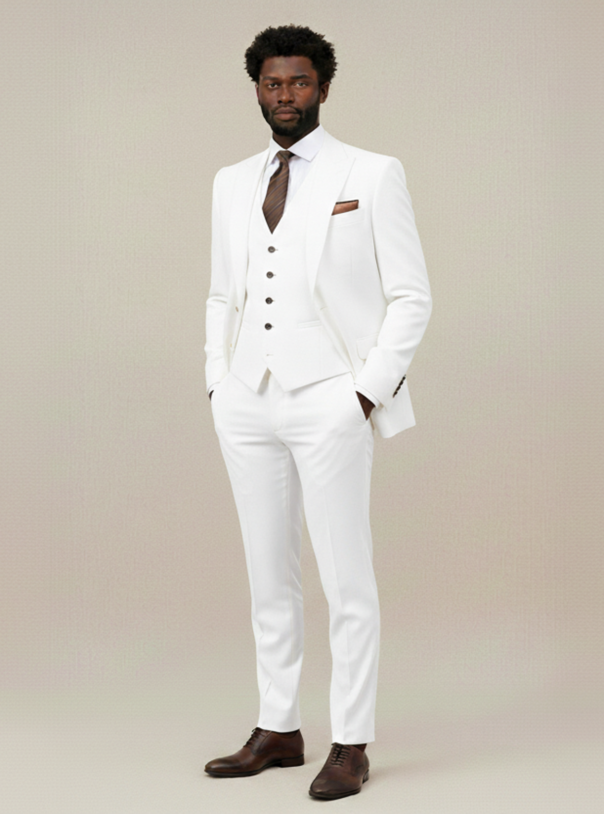 Man wearing a white suit with a brown tie and shoes on a beige background