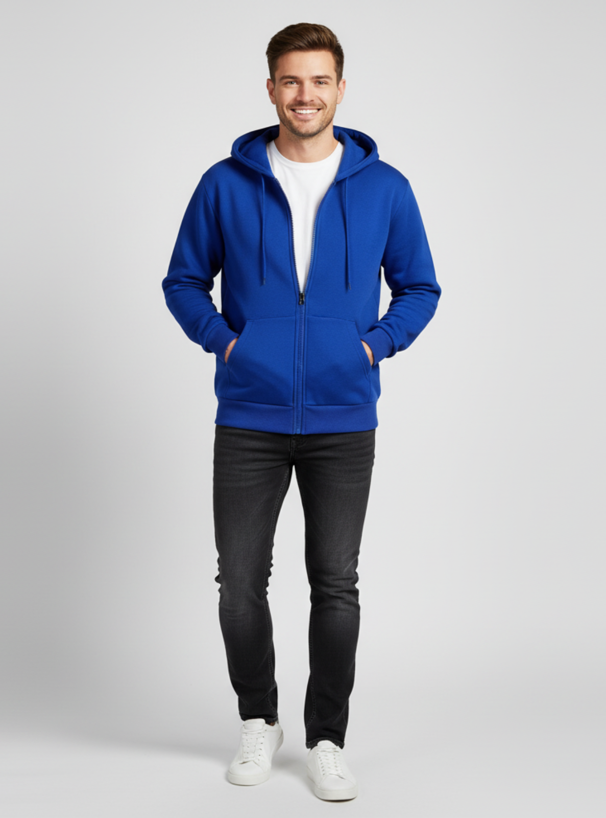 Man wearing a blue hoodie on a gray background